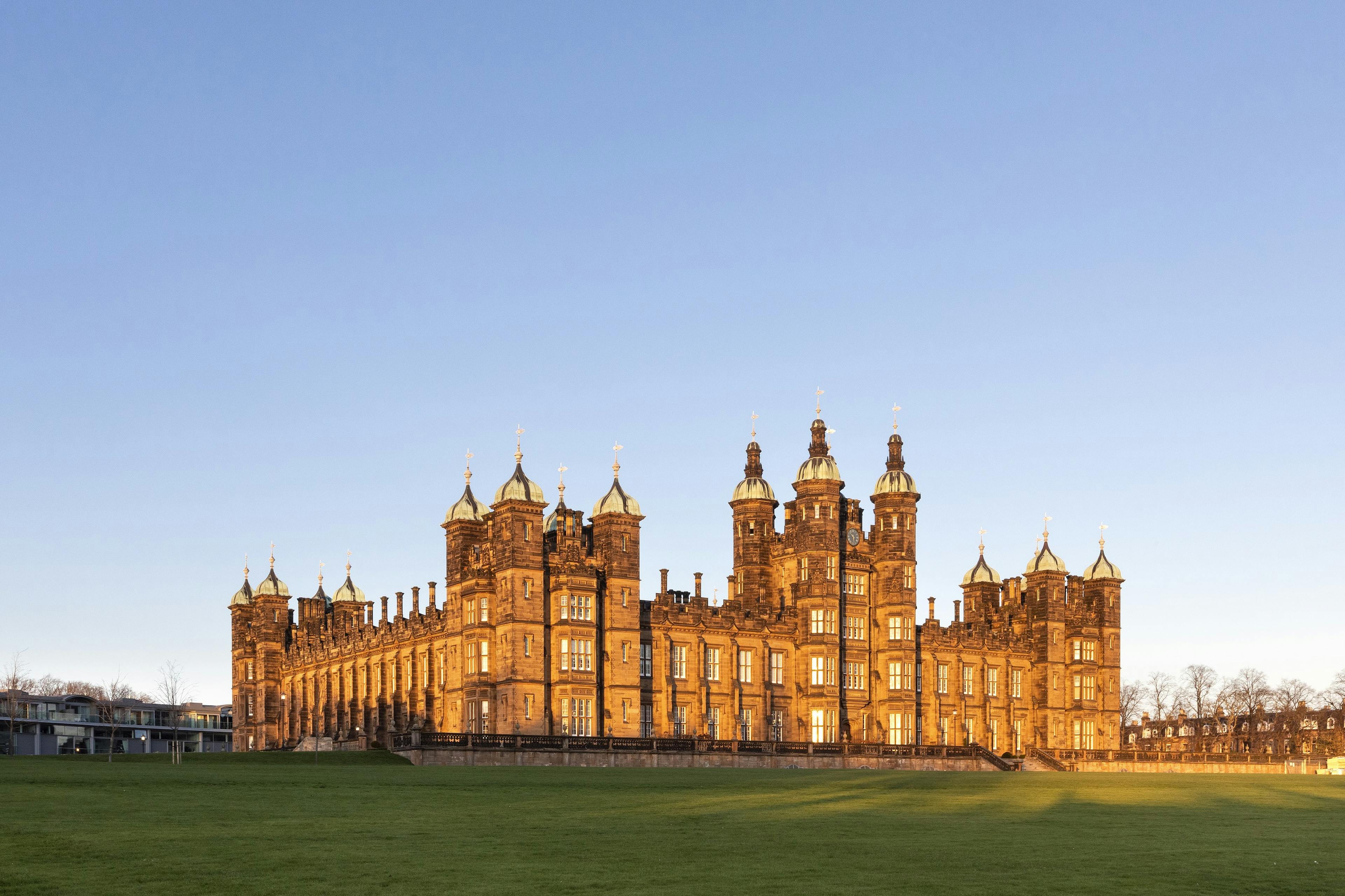 Caption: a large building with a clock tower on top of it