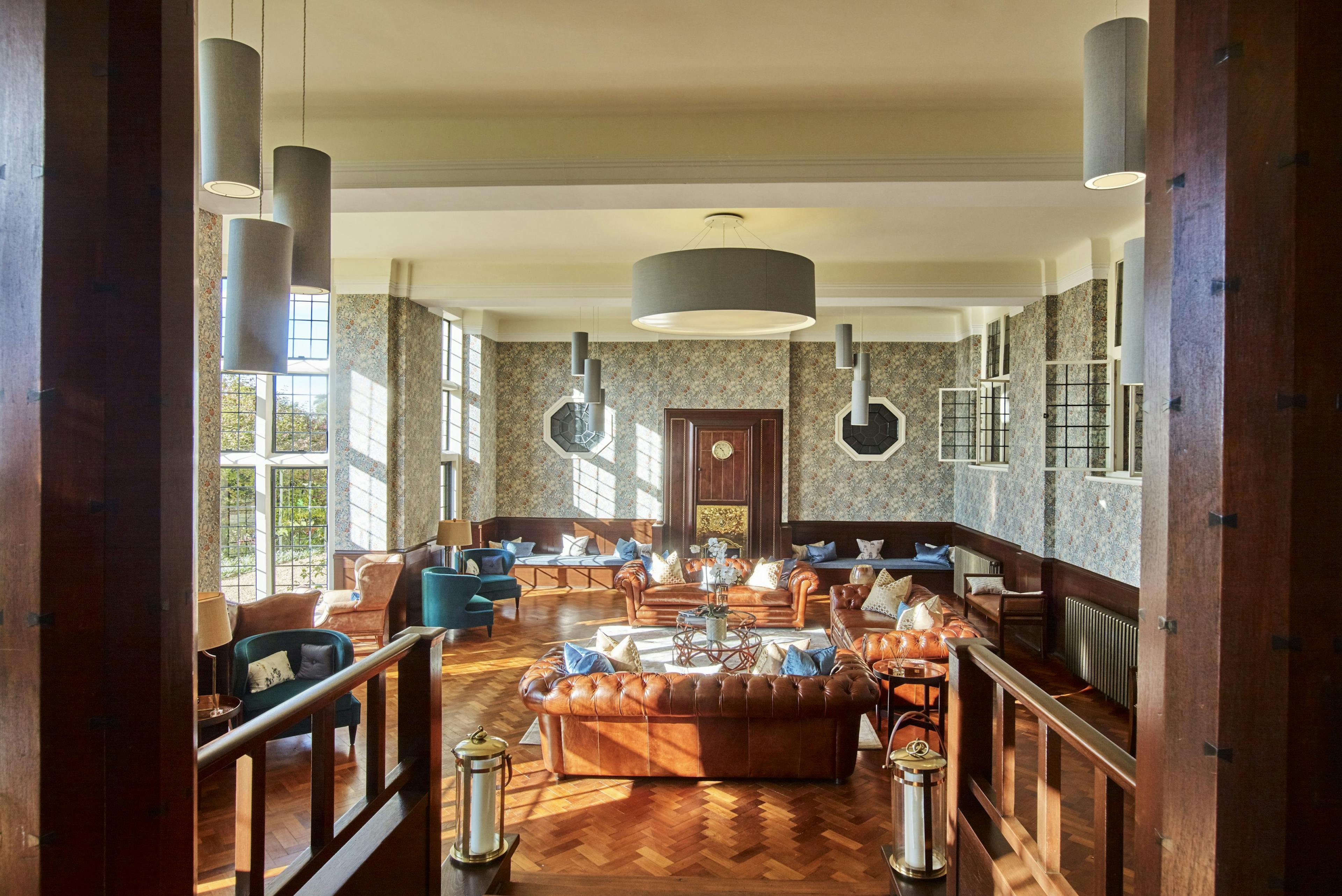 Caption: a living room with a lot of furniture inside of it