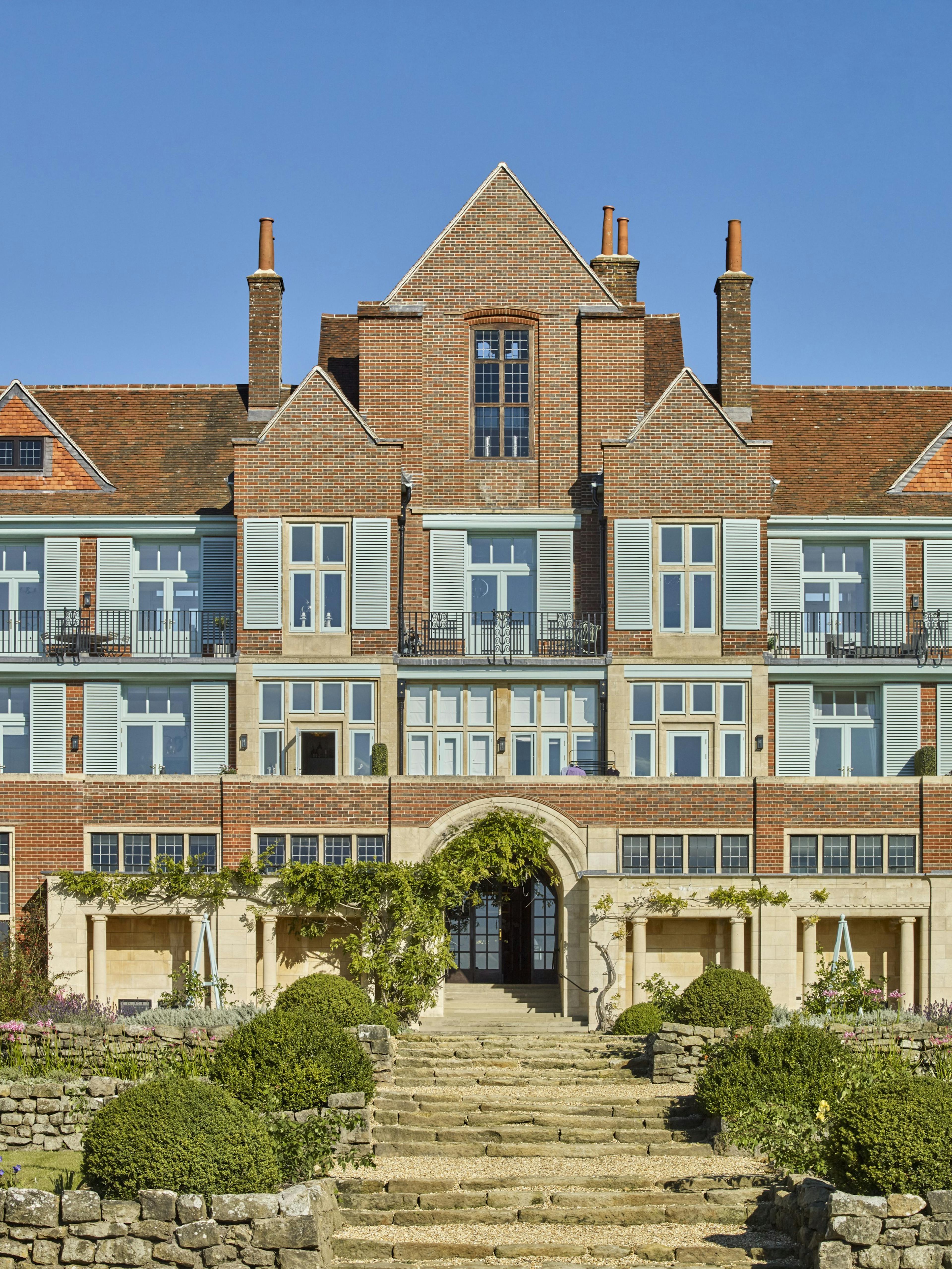 Caption: a large building with many windows and steps leading up to it
