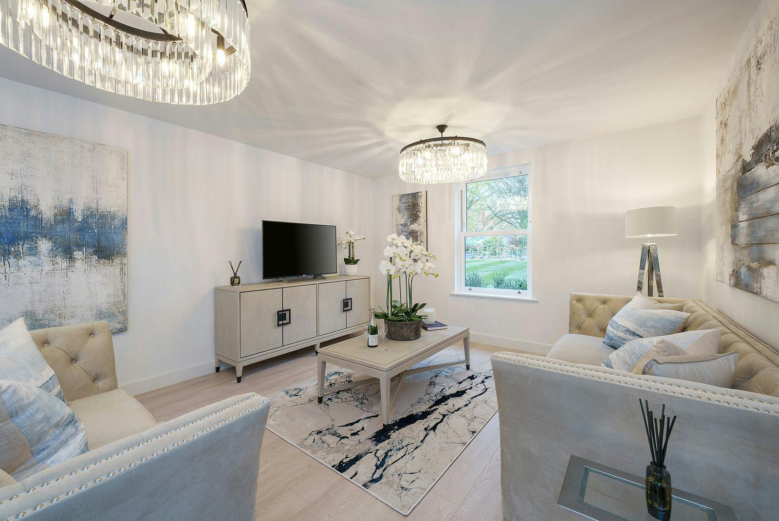 Caption: a living room filled with furniture and a flat screen tv