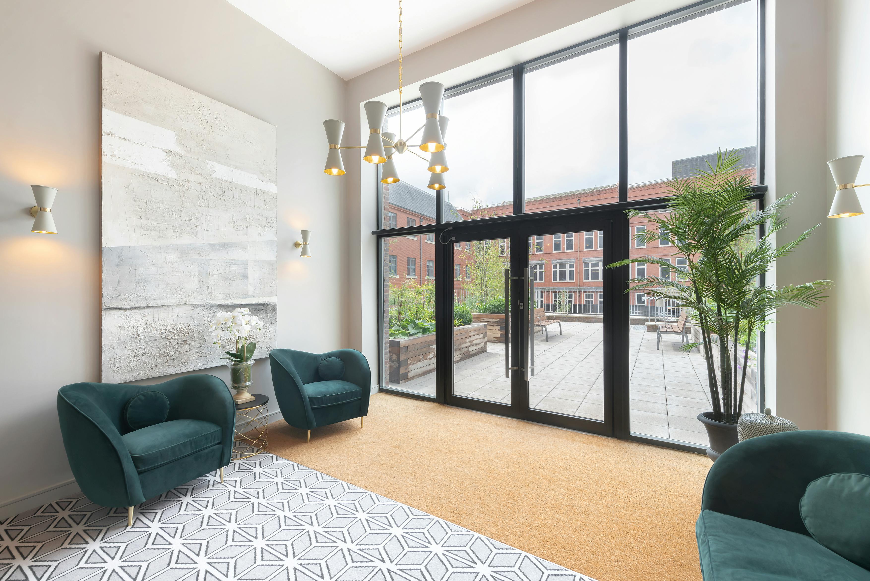 Caption: a living room filled with furniture and a large window