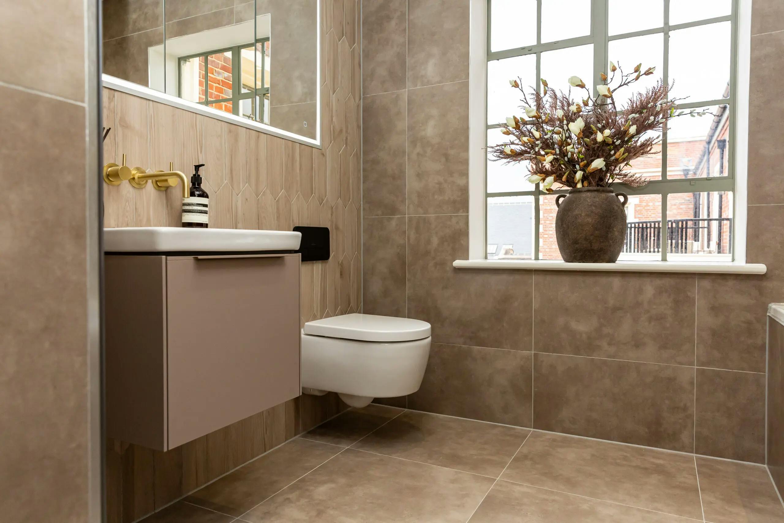 Caption: a white toilet sitting next to a window in a bathroom