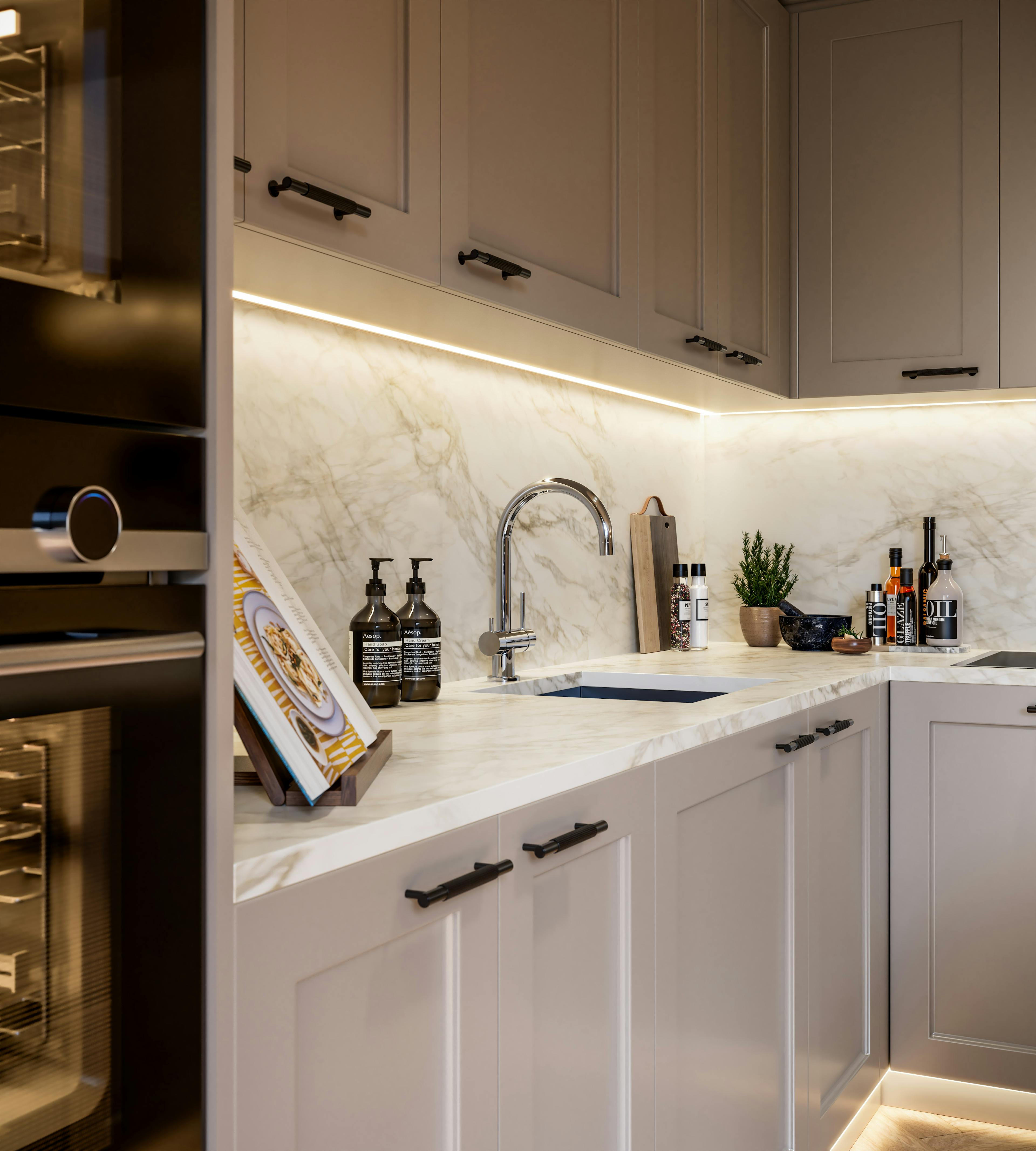 Caption: a kitchen with marble counter tops and white cabinets