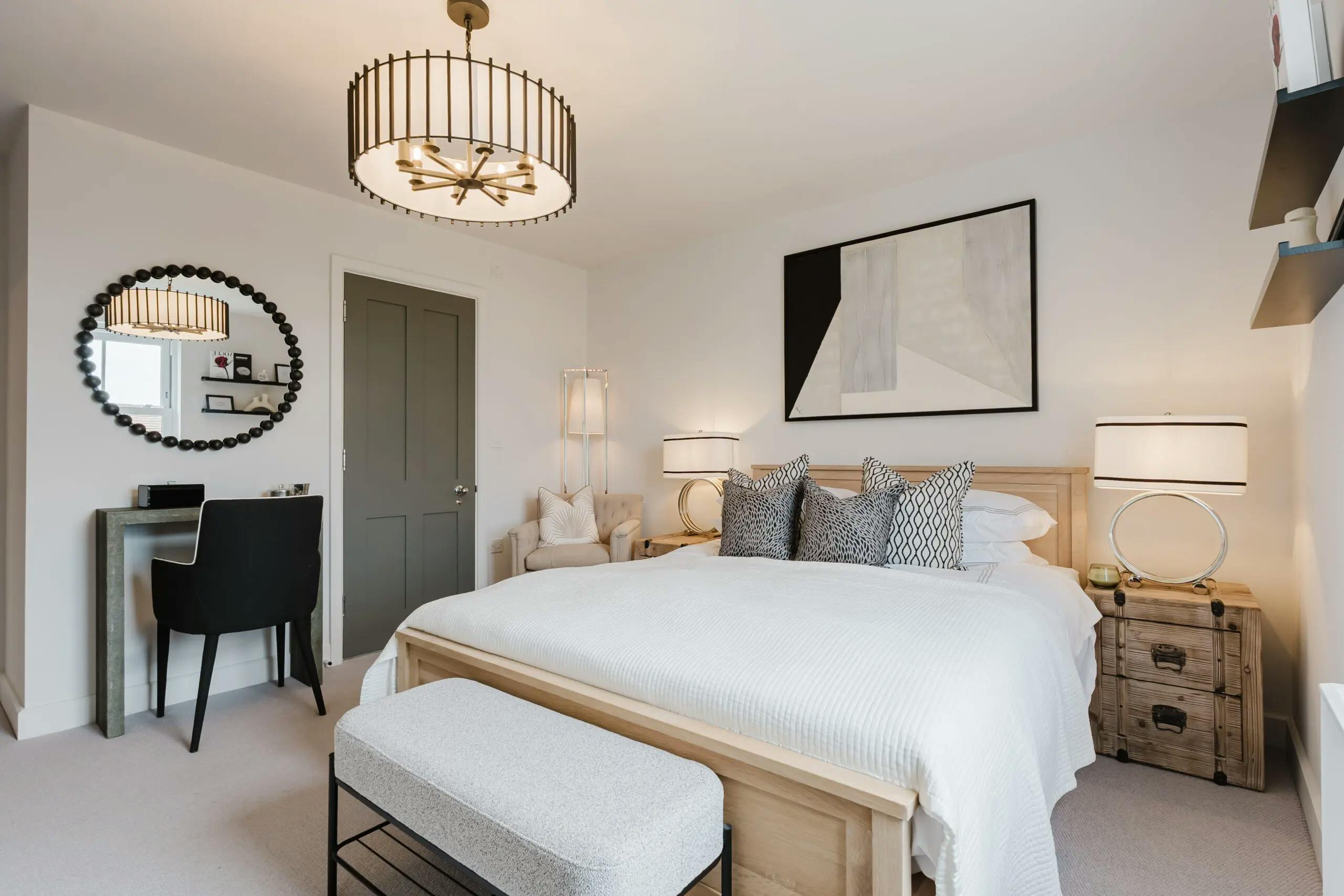 Caption: a bedroom with a large bed and a chair