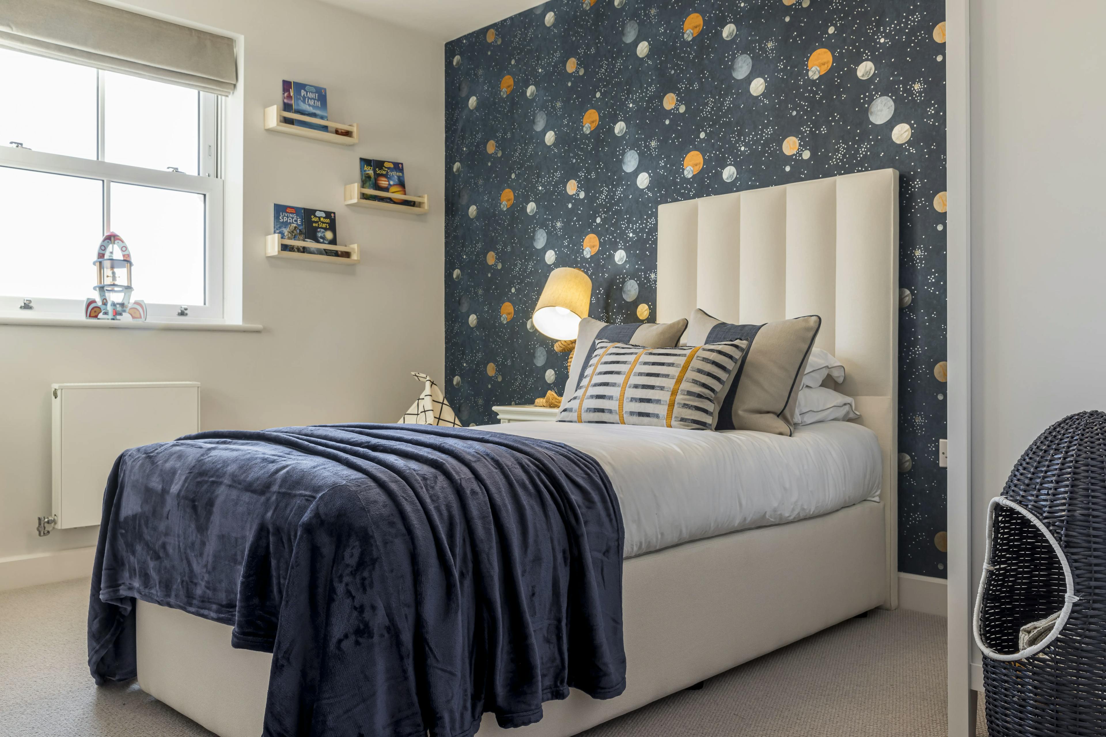 Caption: a bedroom with a bed and a night stand