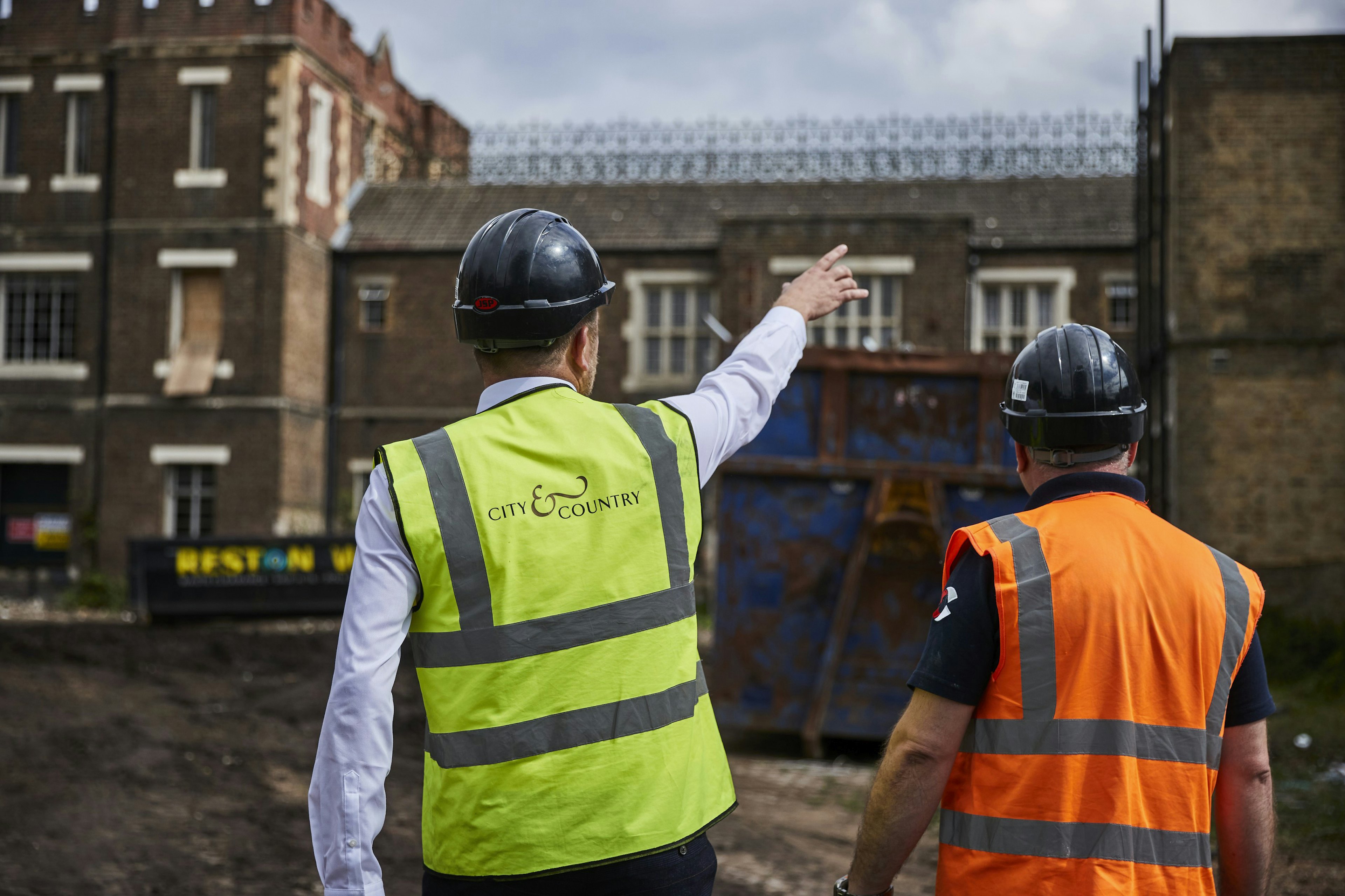 Caption: a couple of men standing next to each other