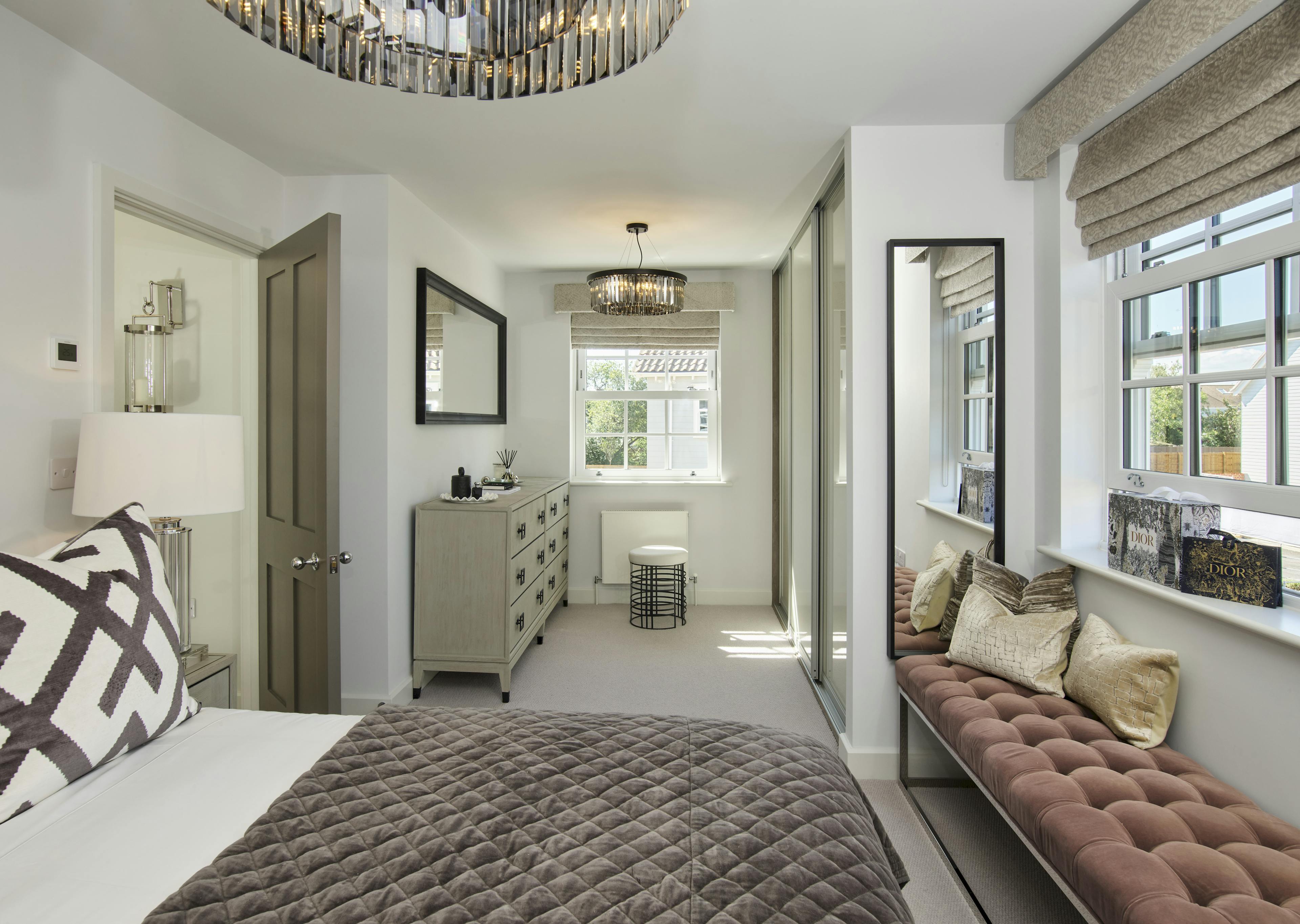 Caption: a bedroom with a large bed and a window