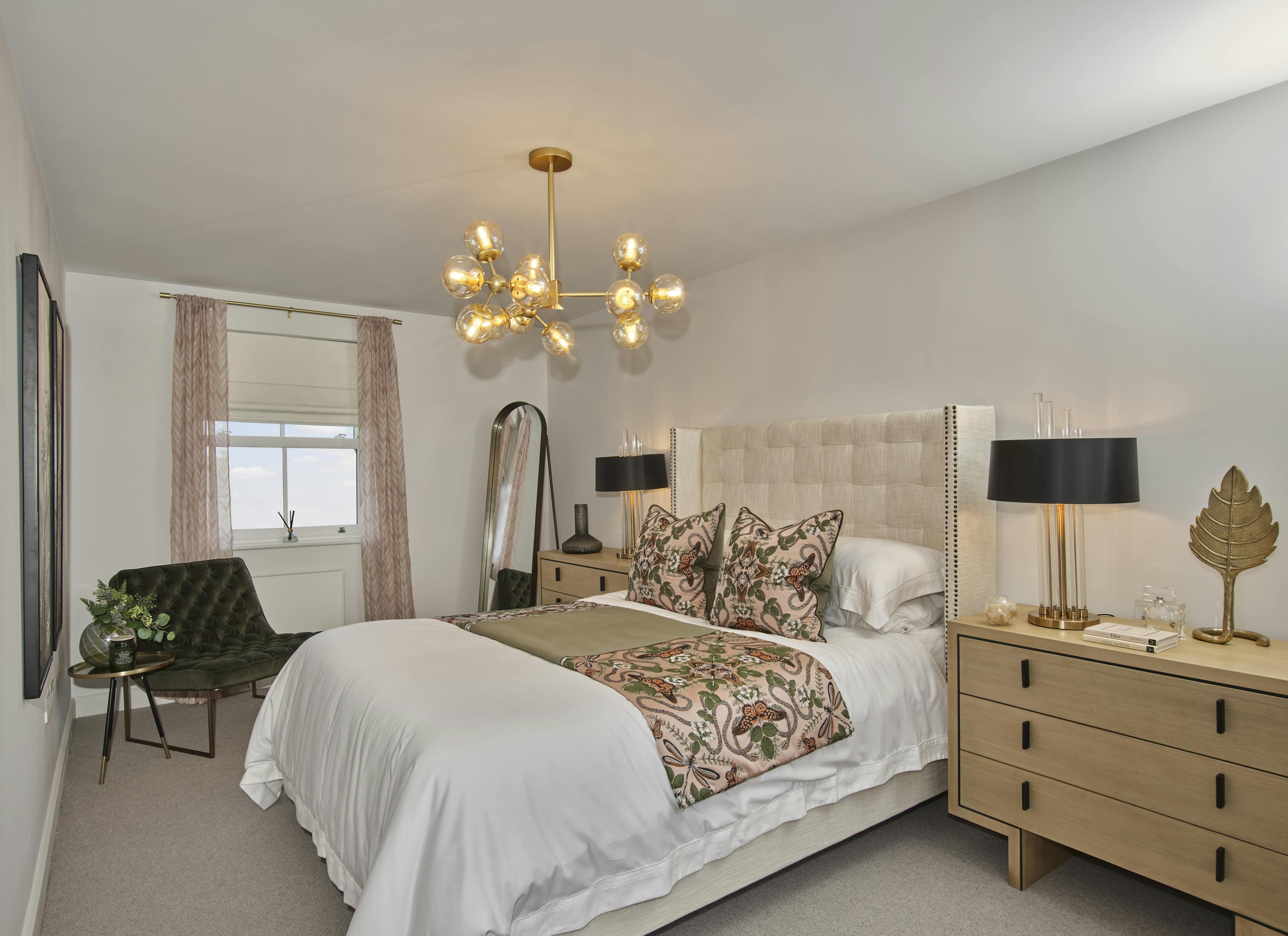 Caption: a bedroom with a bed, dresser and mirror