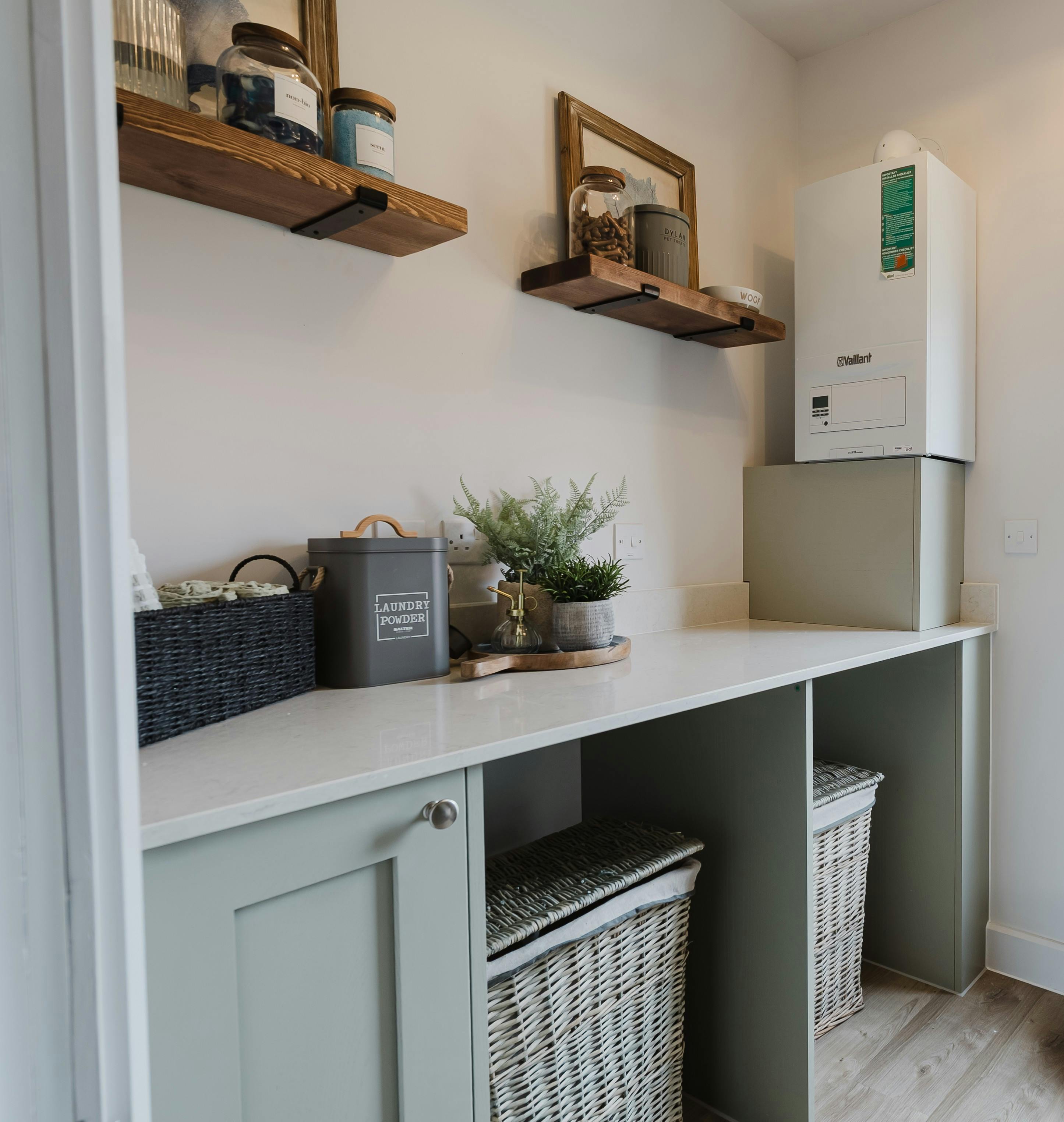 Caption: a kitchen counter with baskets and a refrigerator