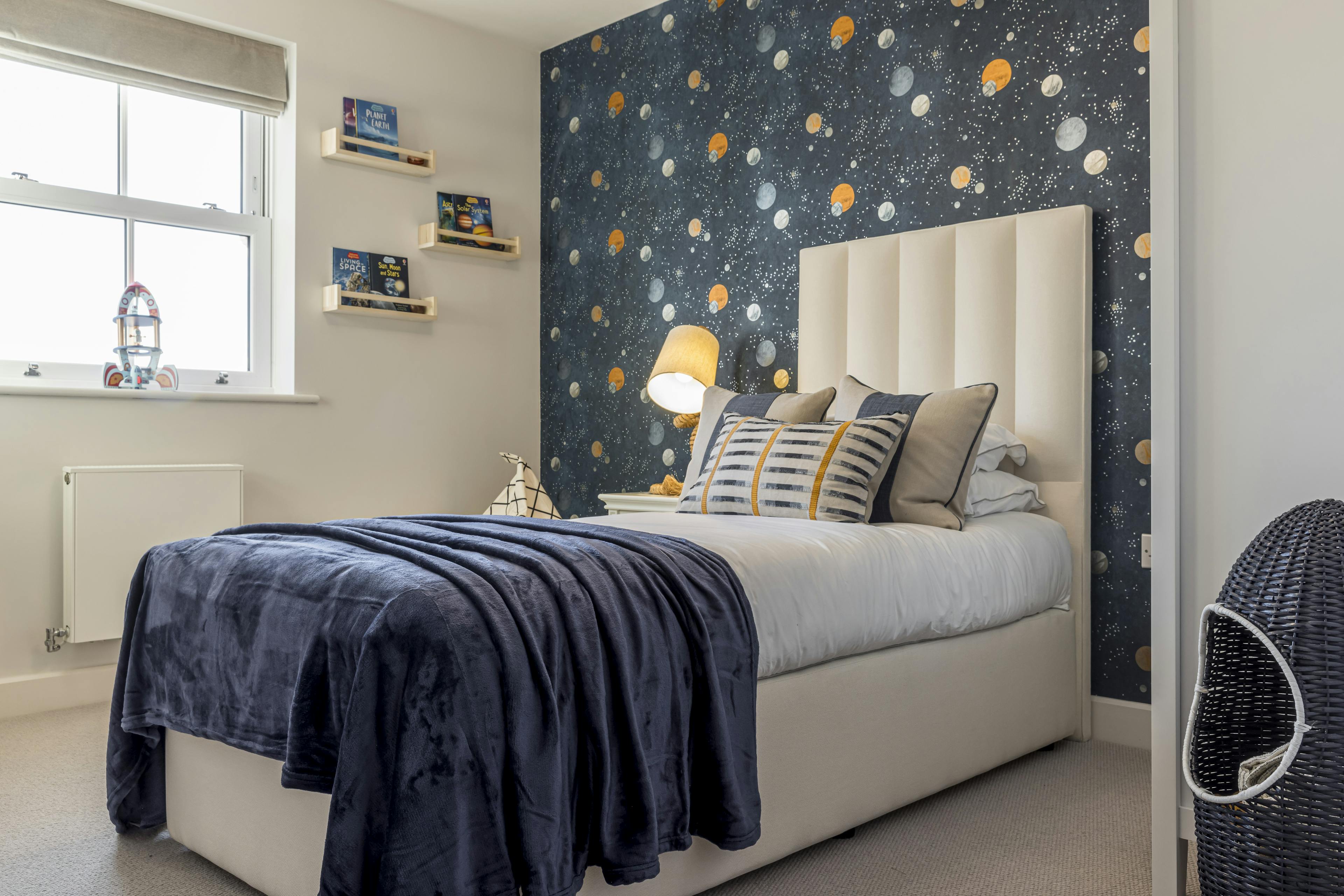 Caption: a bedroom with a bed and a night stand