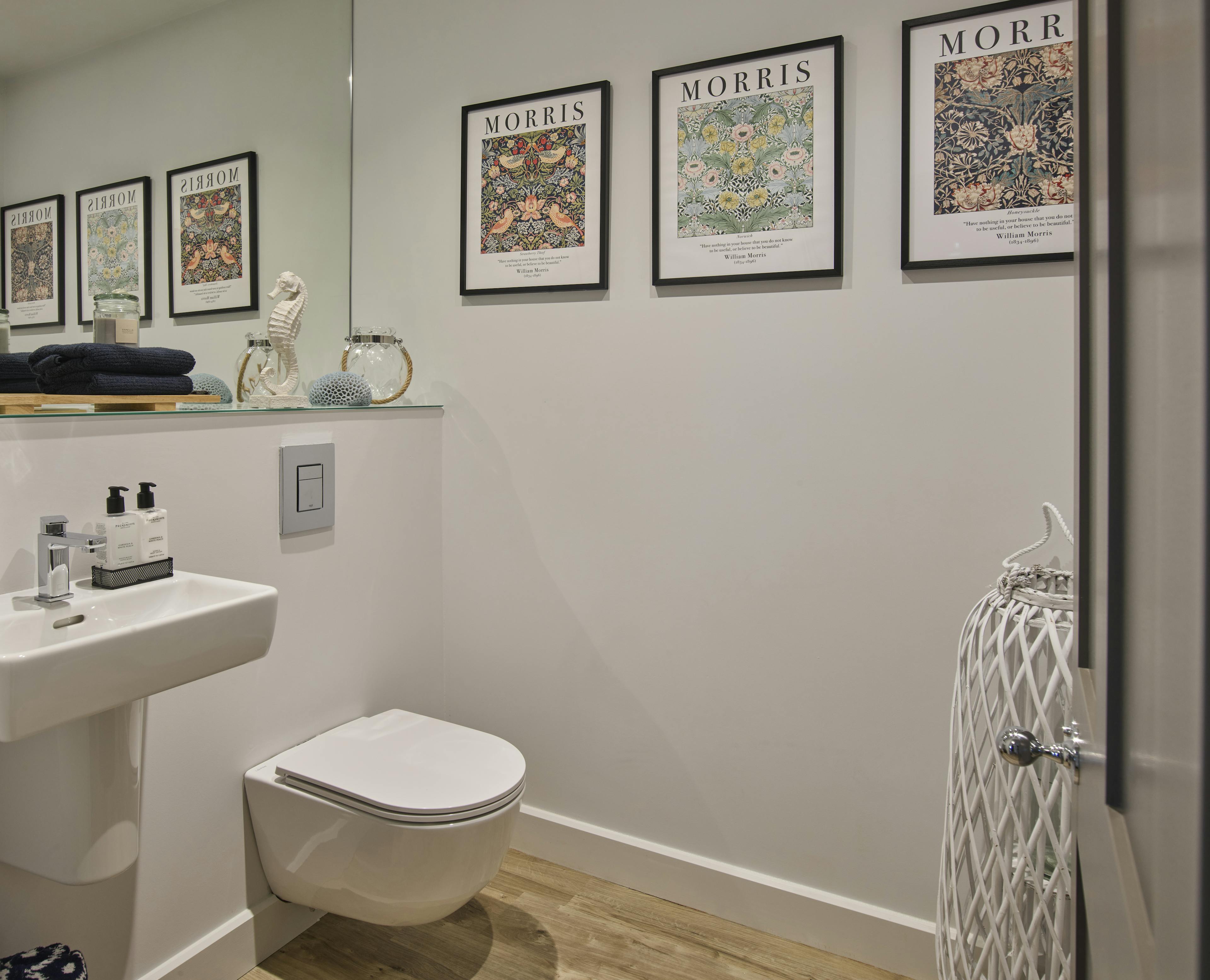 Caption: a white toilet sitting next to a white sink