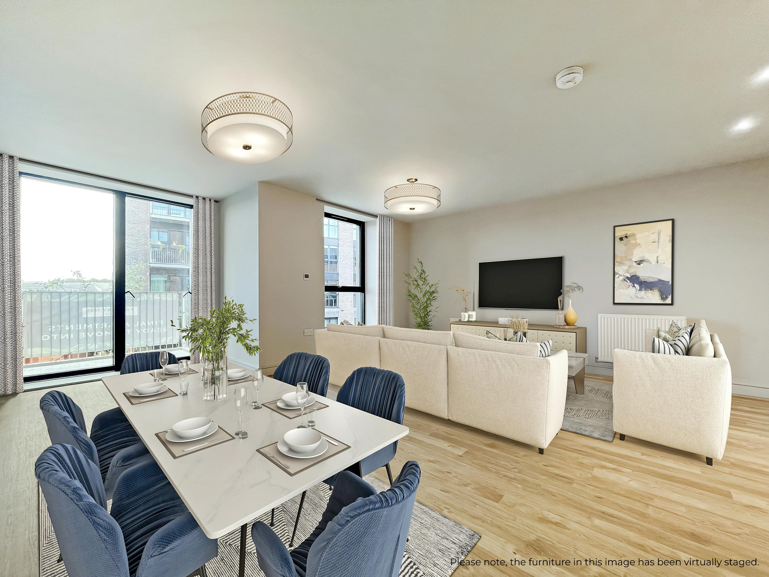 Caption: a dining room table with blue chairs and a television