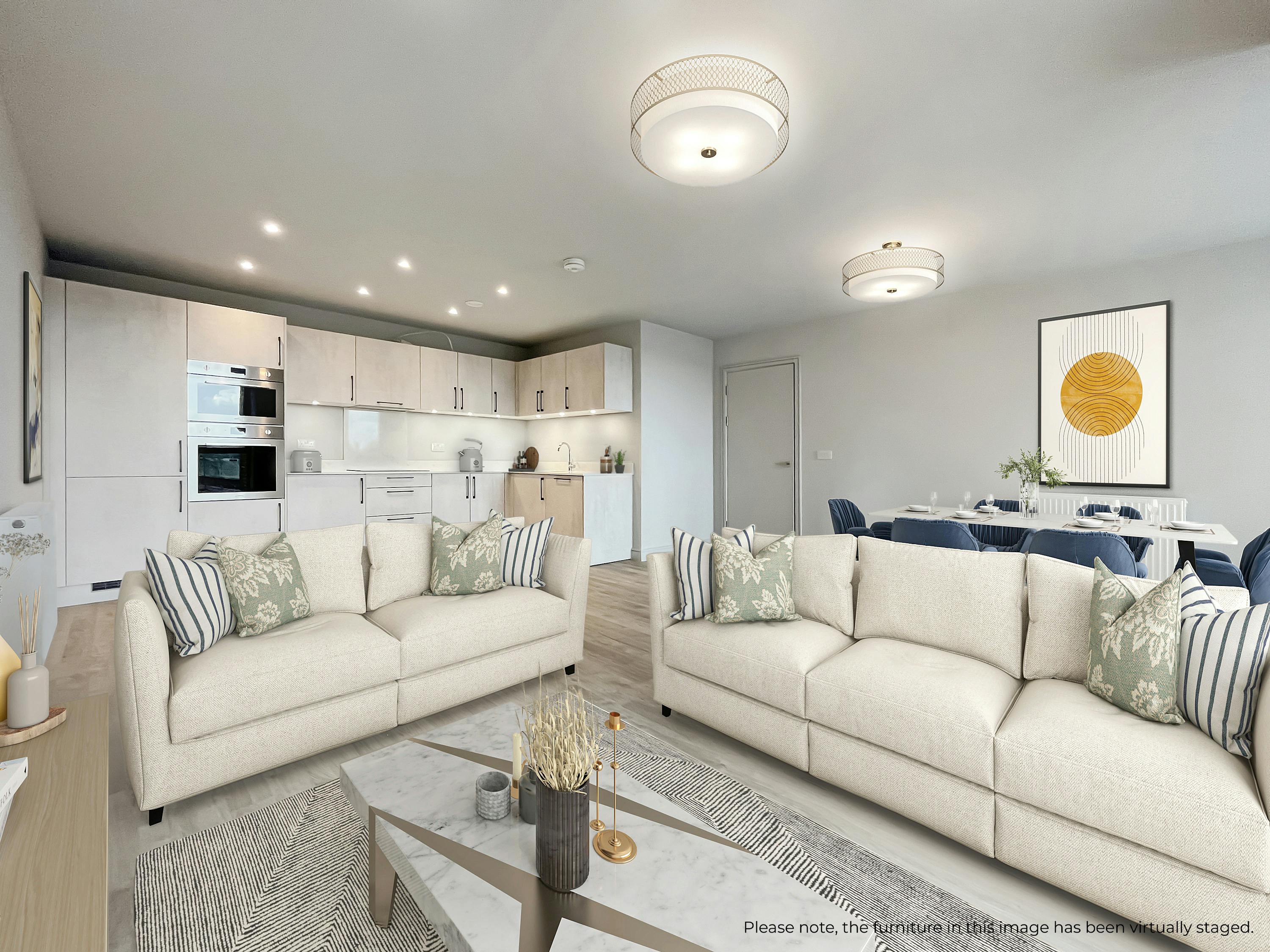 Caption: a living room filled with furniture next to a kitchen