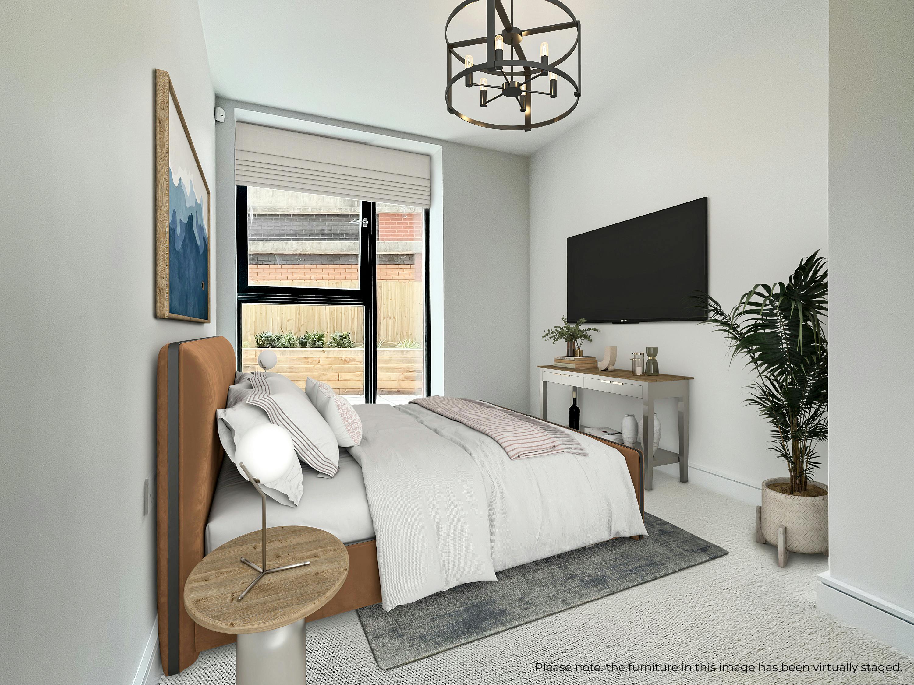 Caption: a bedroom with a large bed and a flat screen tv