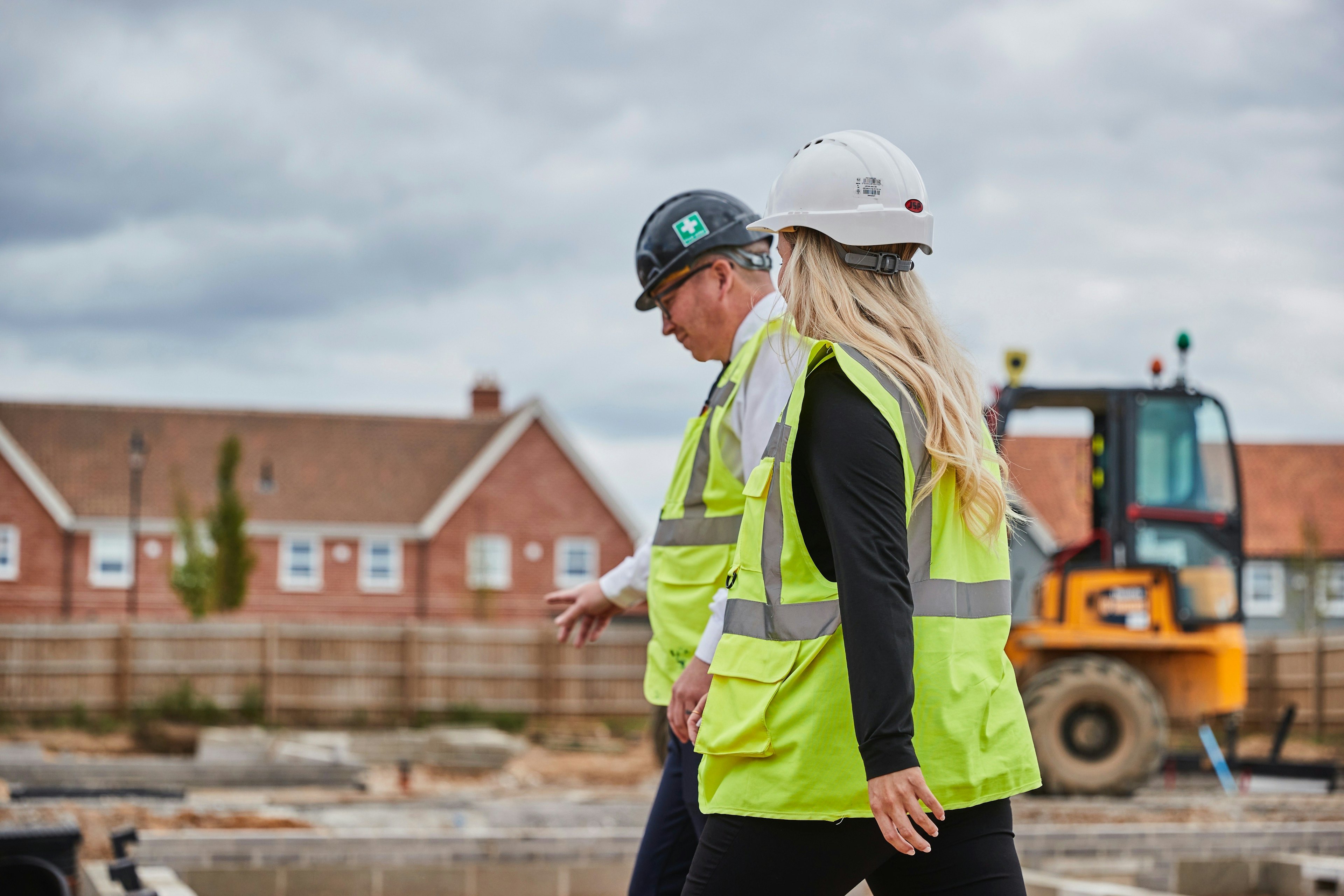 Caption: a couple of people that are standing in the dirt