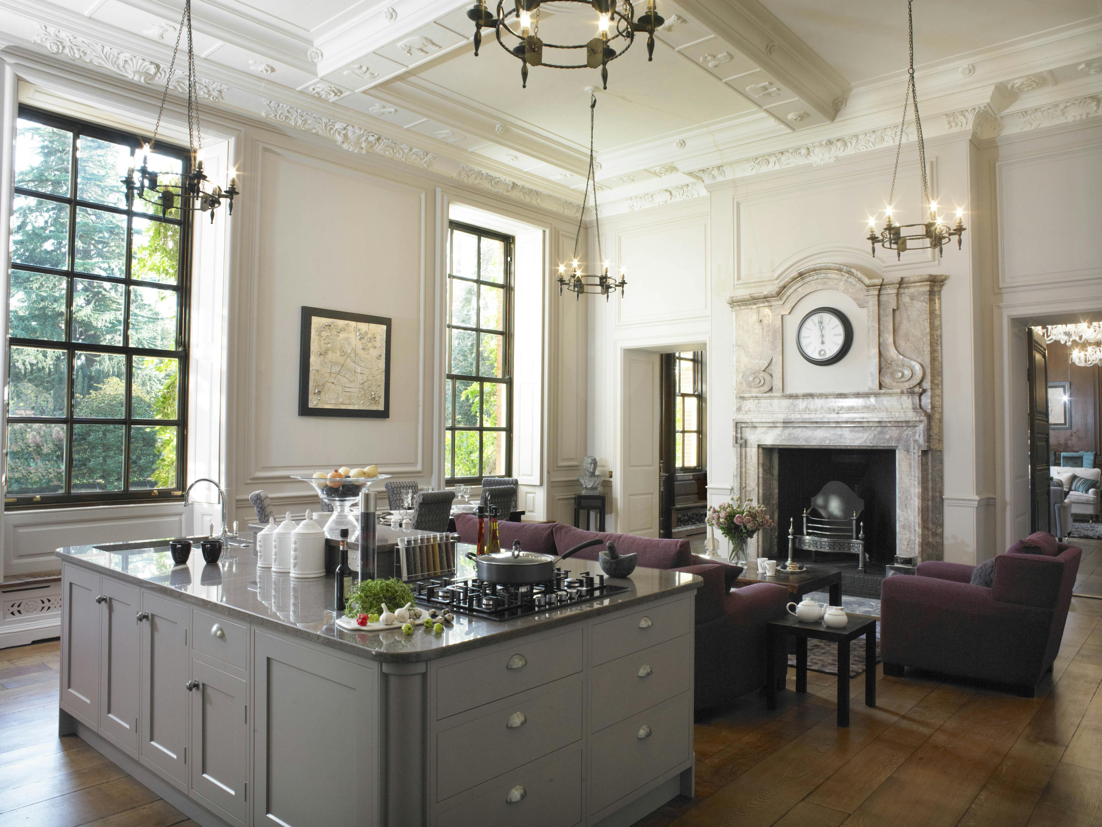 Caption: a living room filled with furniture and a fire place