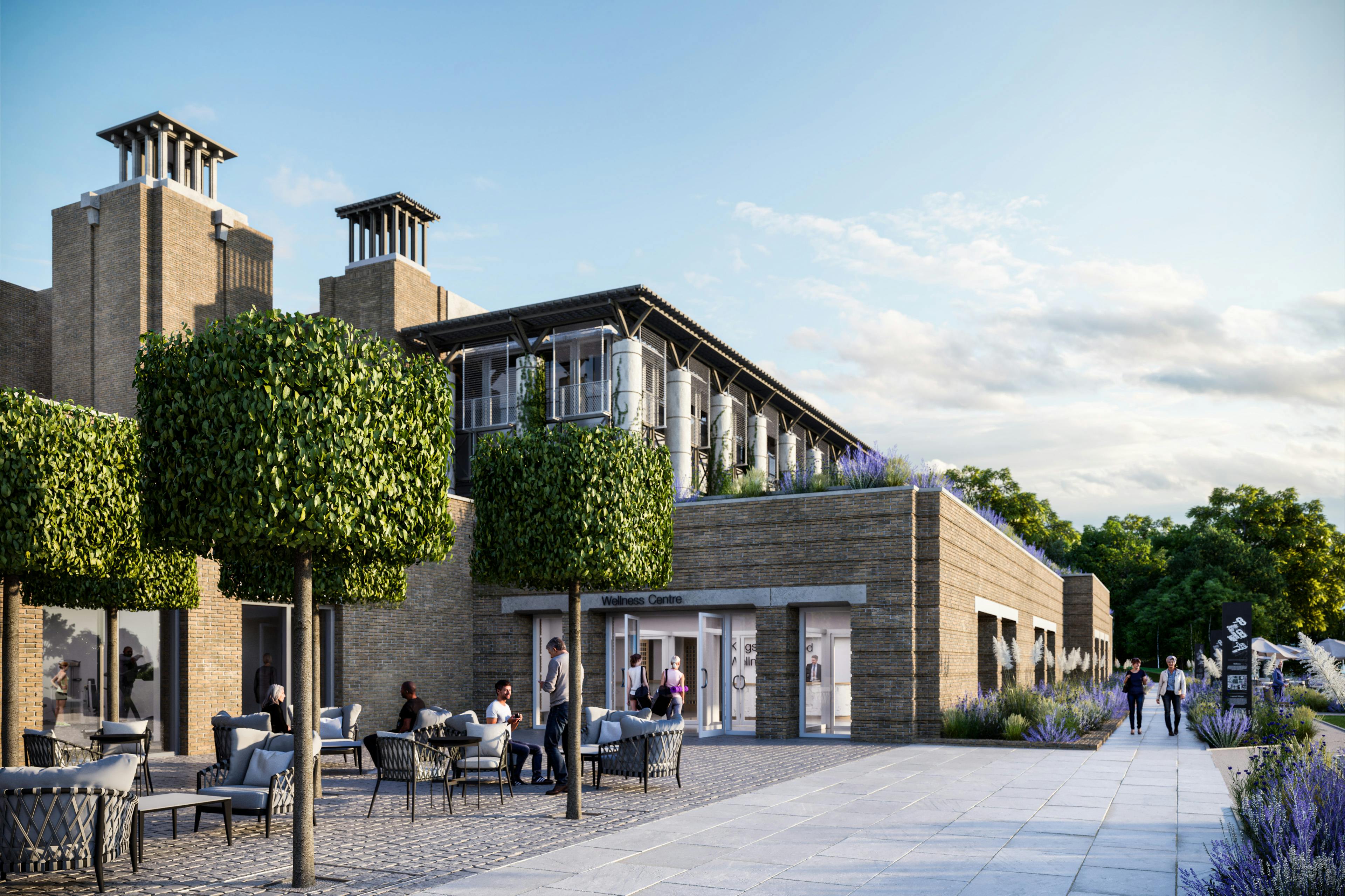 Caption: a group of people sitting at a table outside of a building