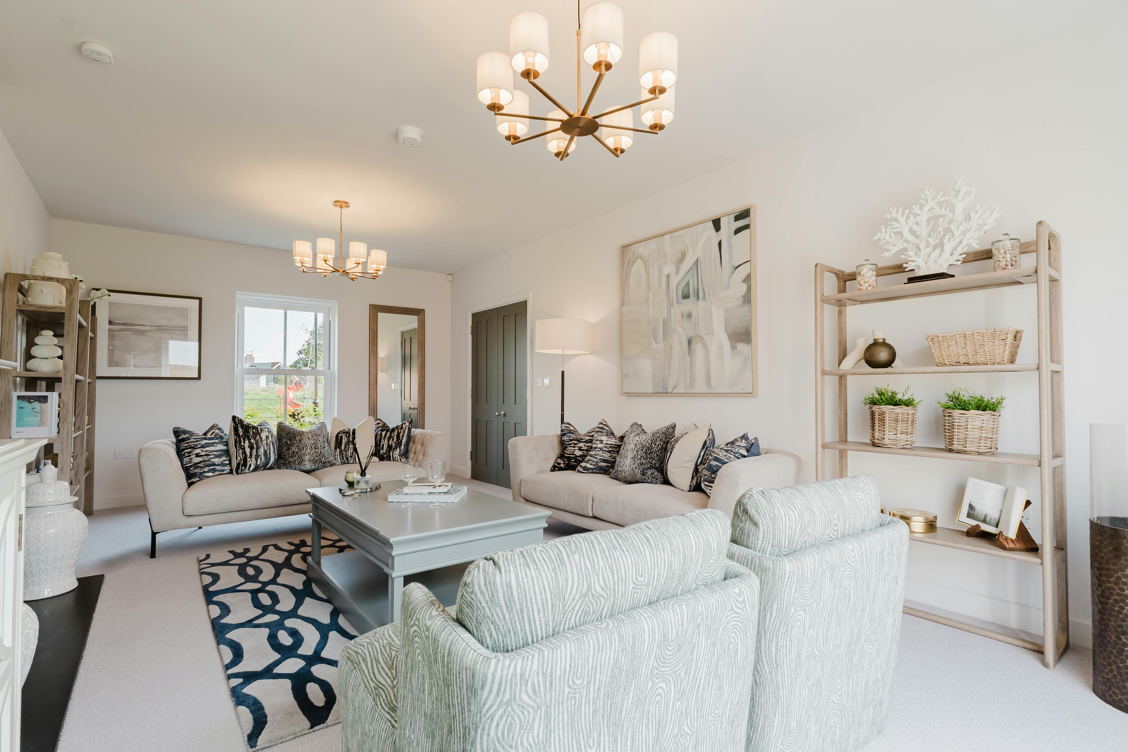 Caption: a living room filled with furniture and a fire place