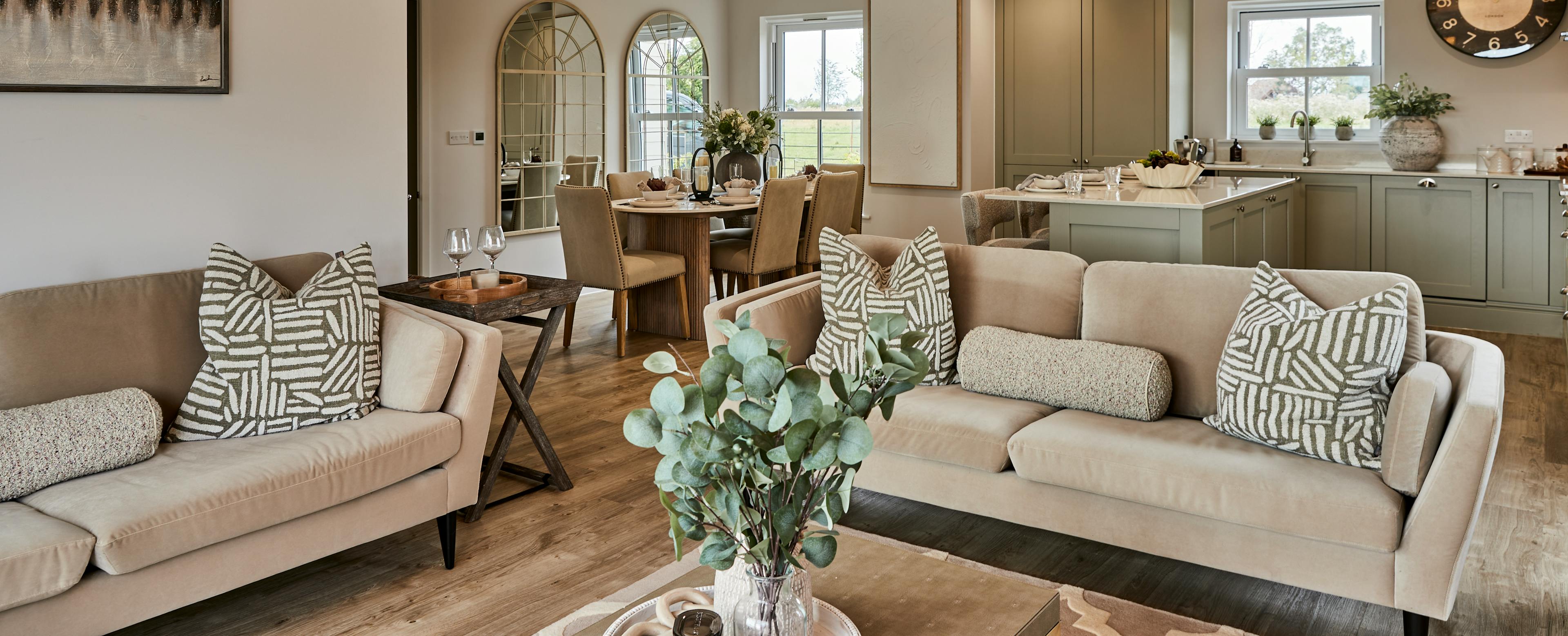 Caption: a living room filled with furniture and a chandelier