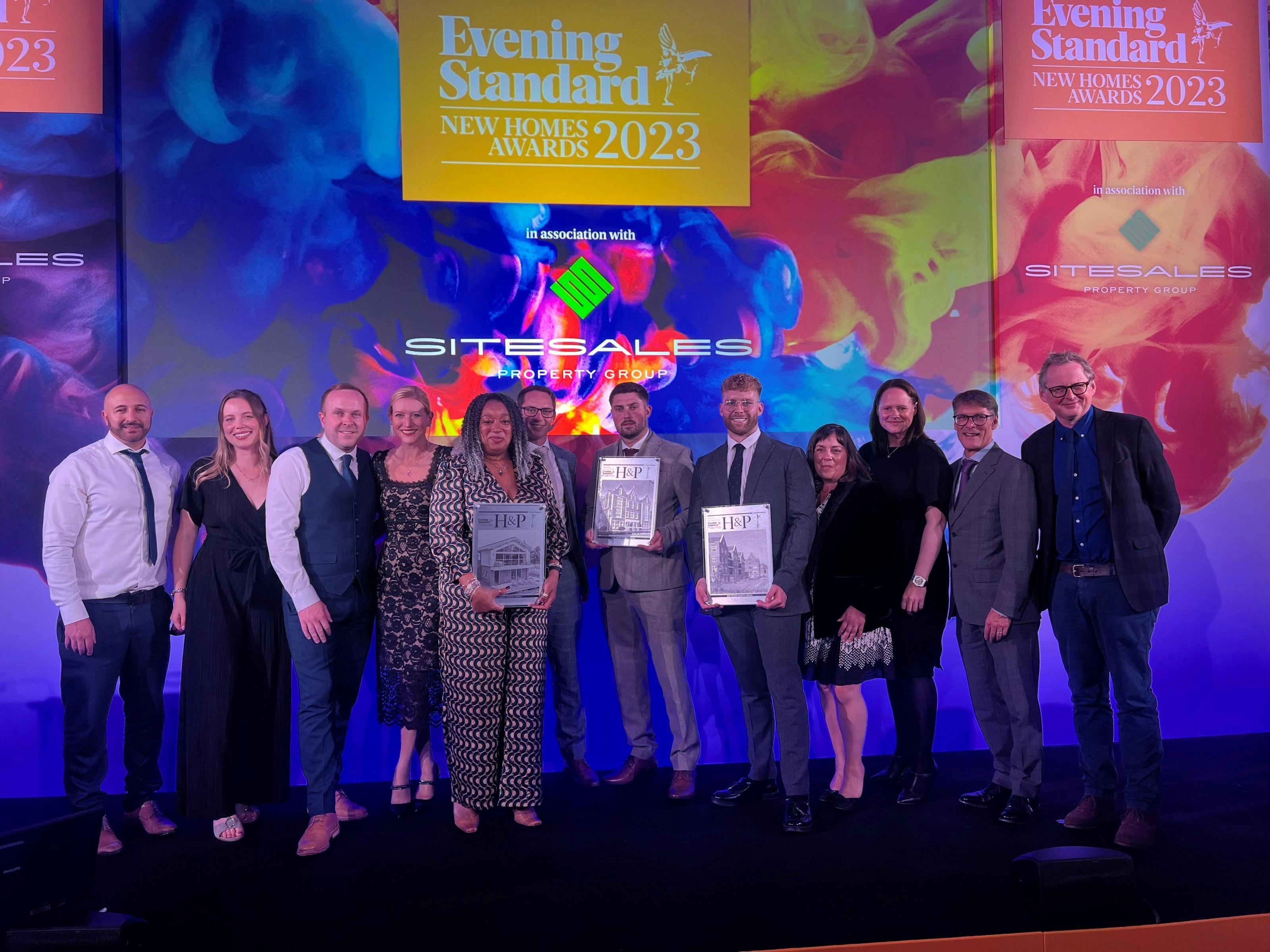 Caption: a group of people standing on a stage