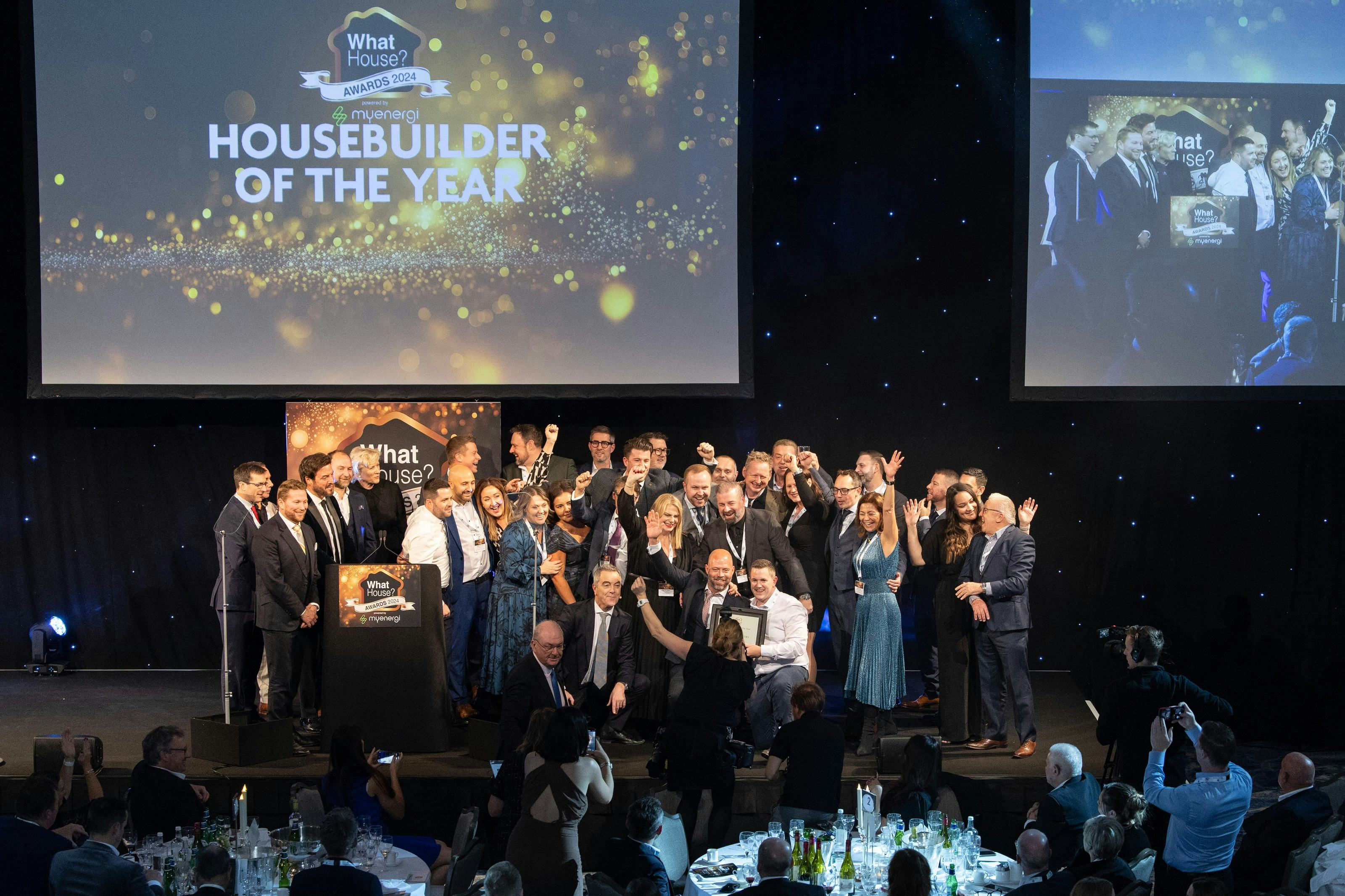 The City & Country team collecting an award on stage