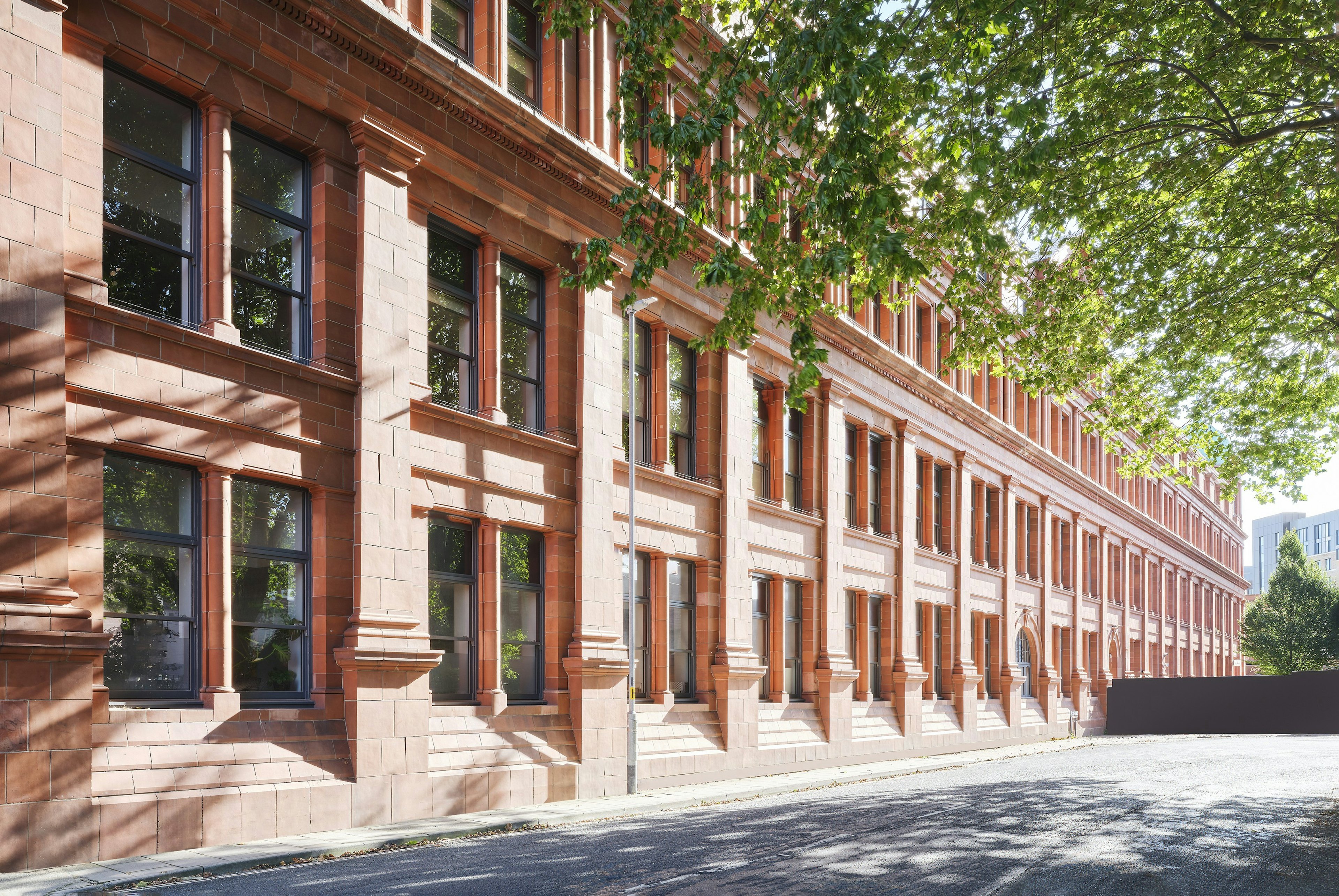A brick building with trees in the background