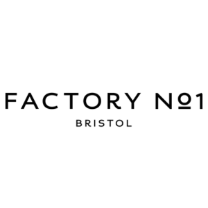 Caption: a black and white photo of the factory logo