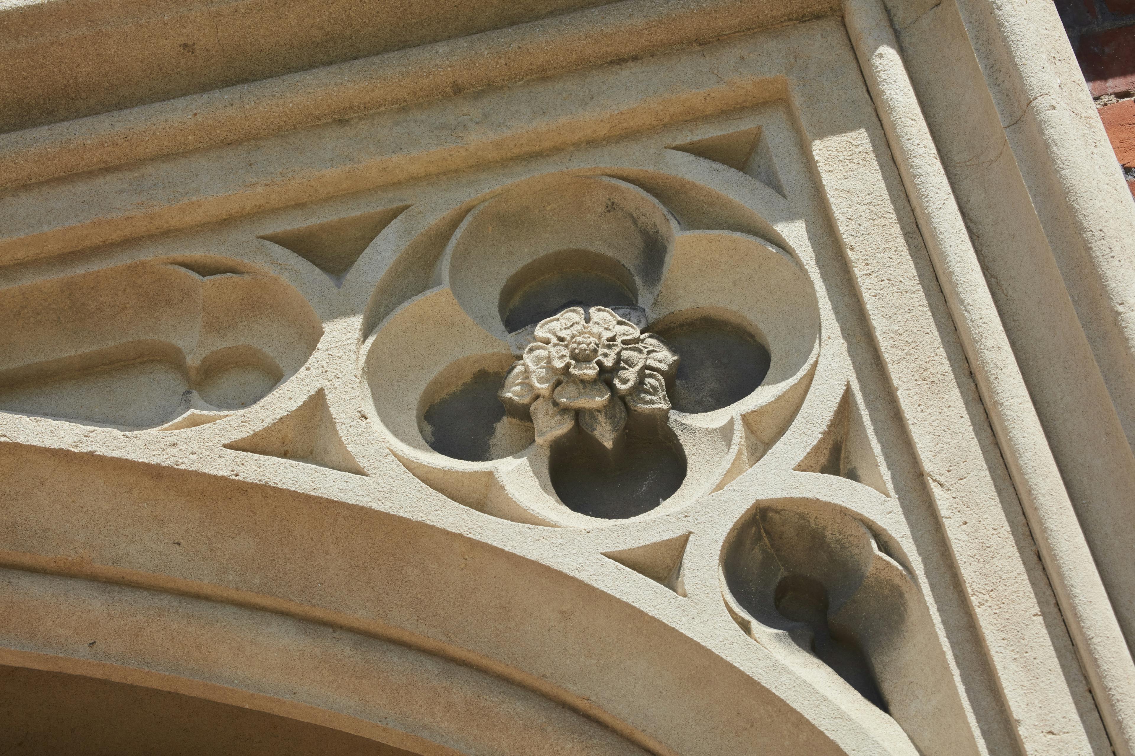 Caption: a close up of a building with a clock on it's face