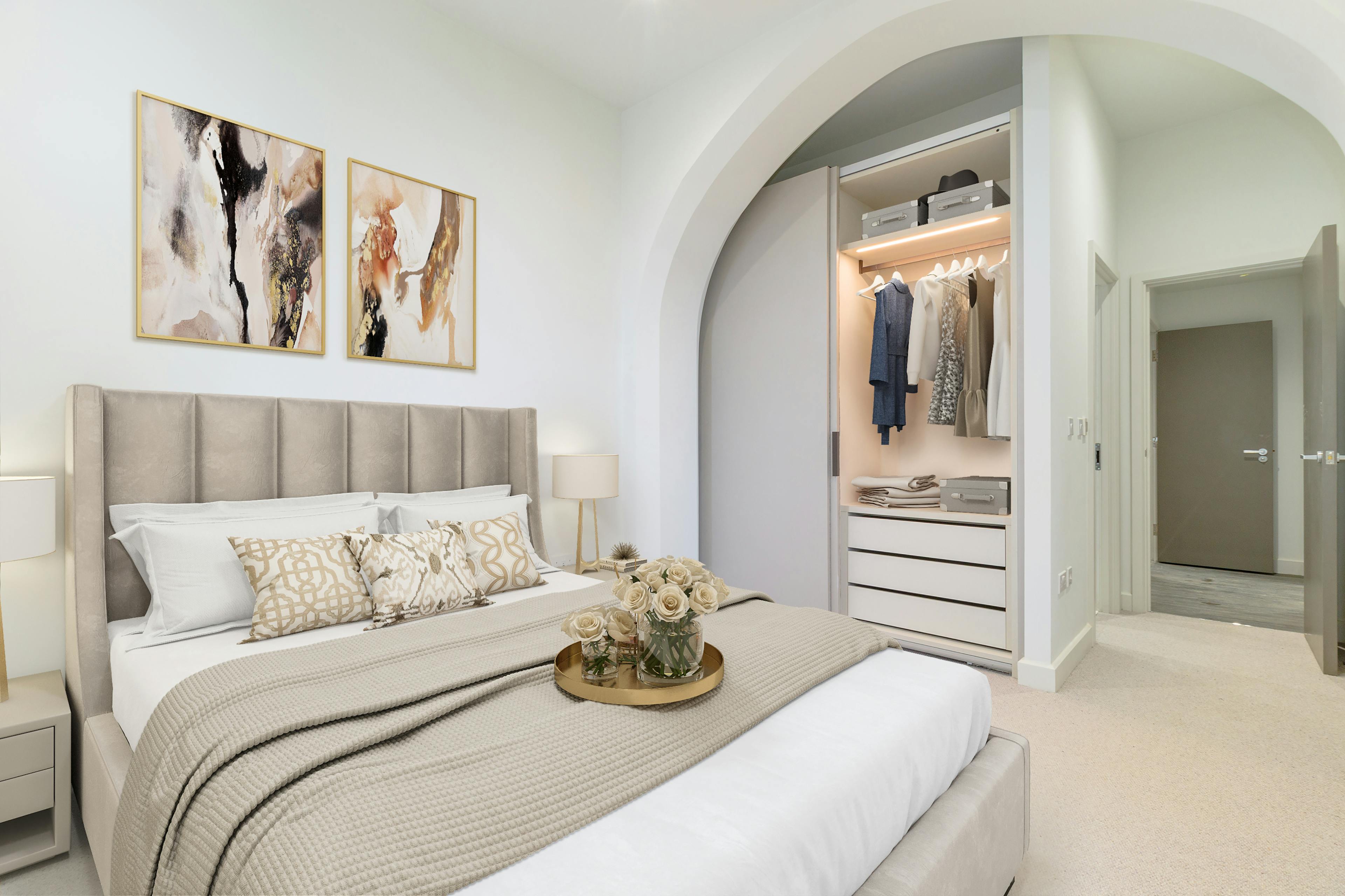 Caption: a bedroom with a bed, dresser, and closet