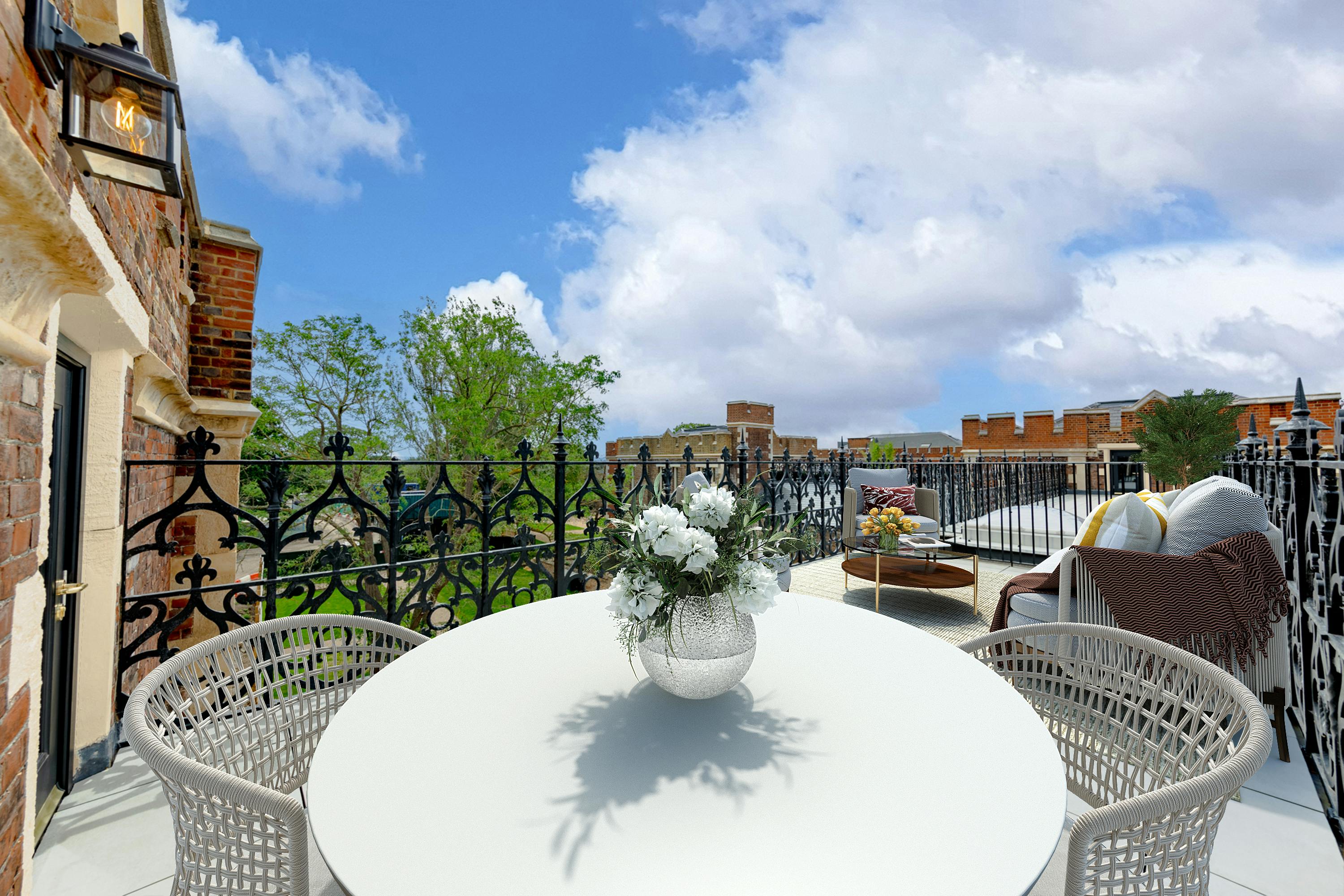 Caption: a white table and chairs on a balcony