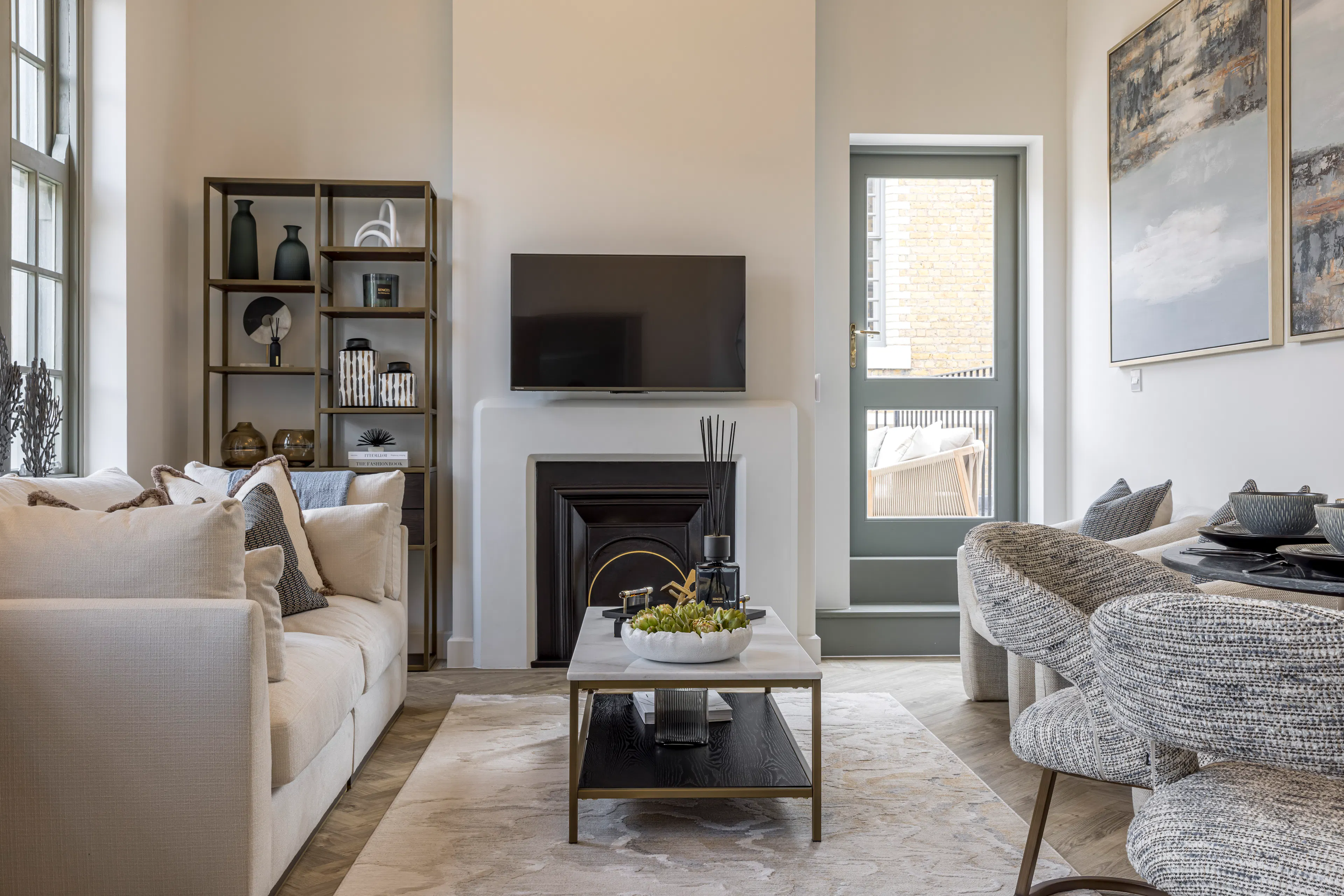 Caption: a living room filled with furniture and a fire place