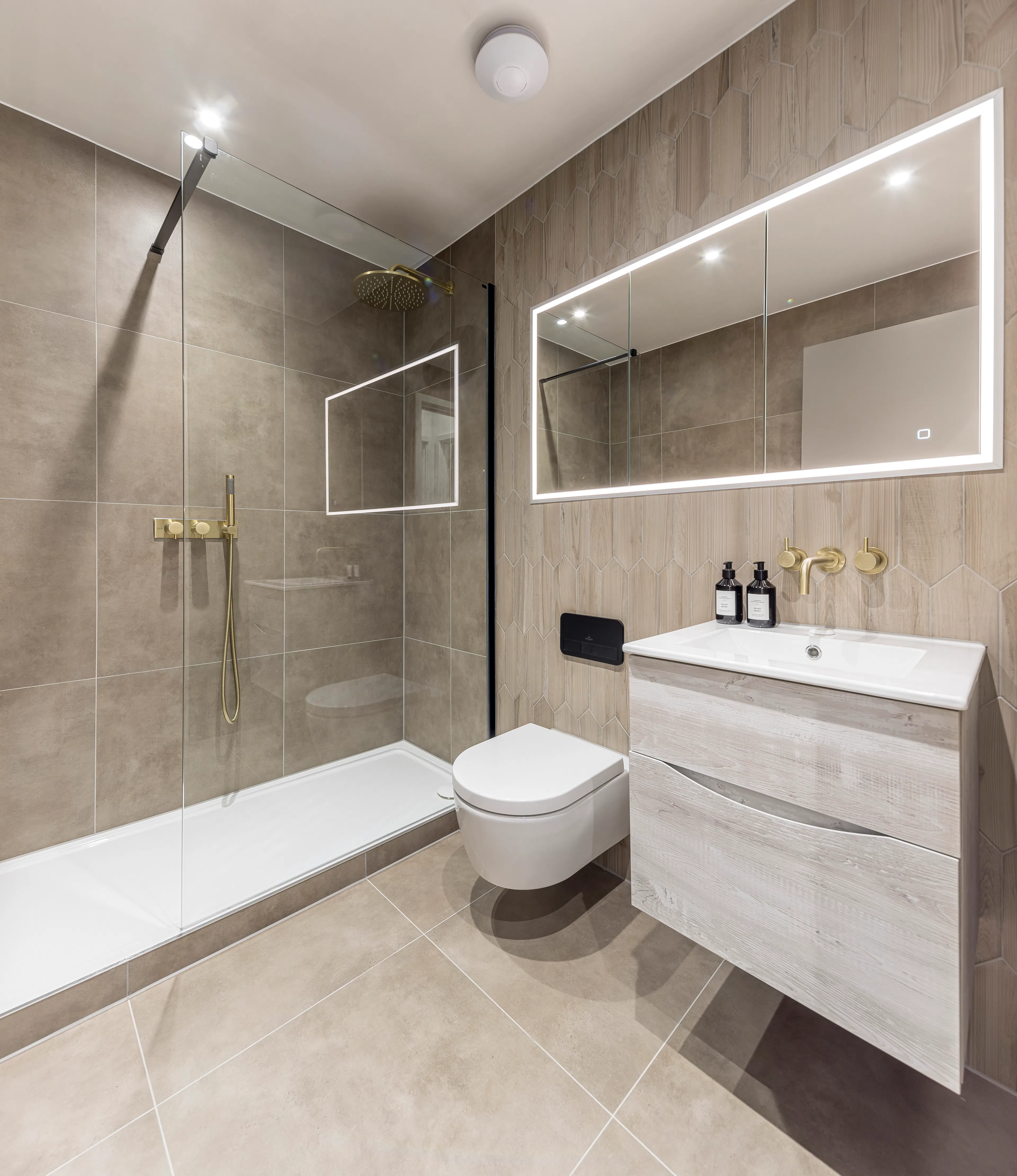 Caption: a bathroom with a toilet, sink, mirror and shower