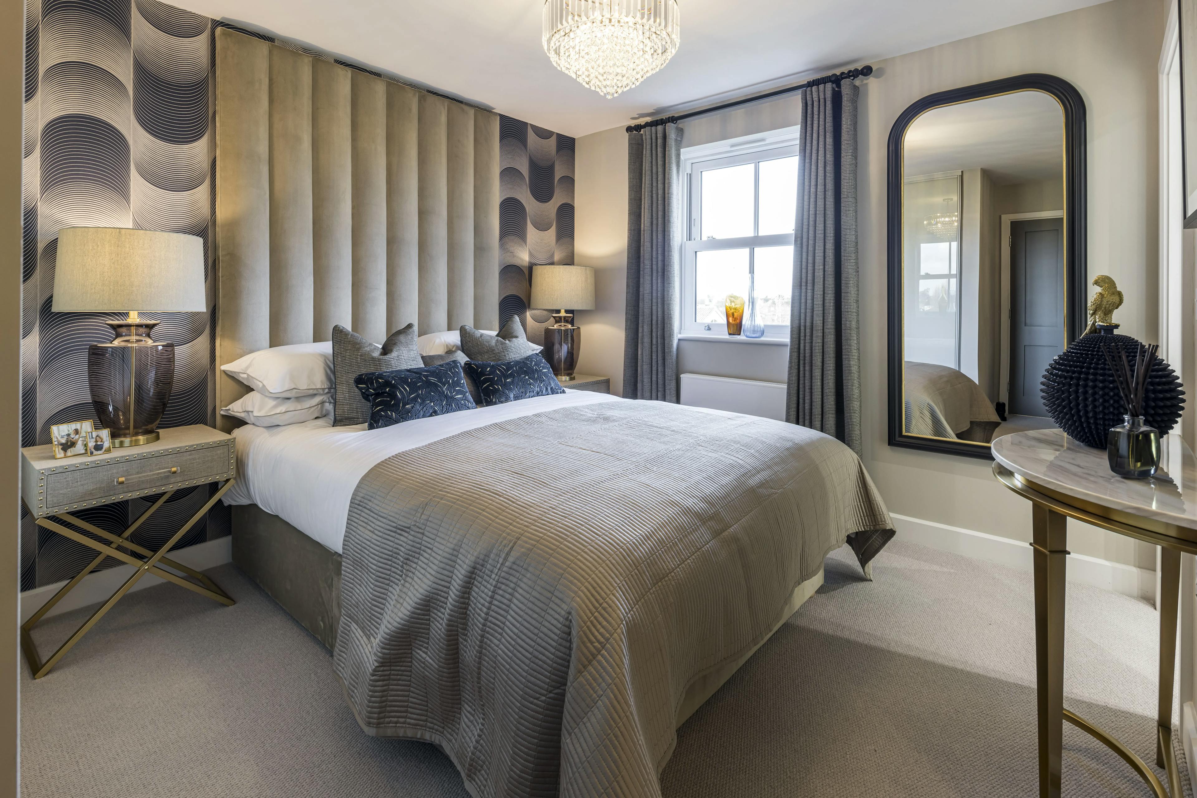 Caption: a bedroom with a large bed and a mirror