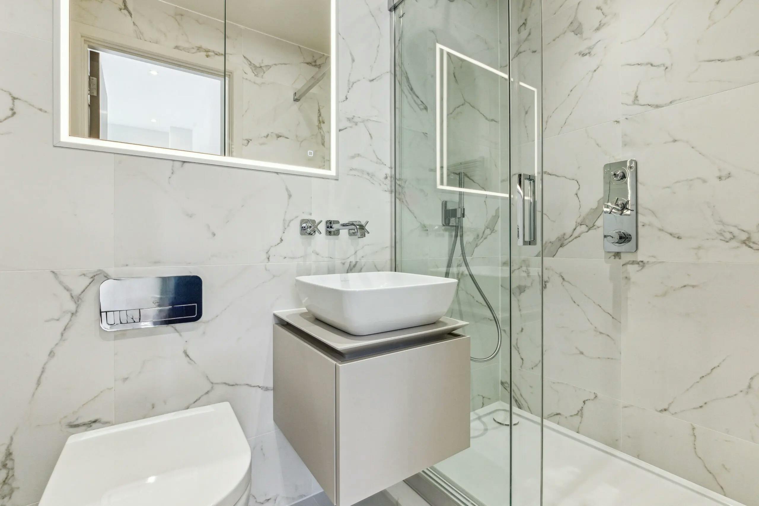 Caption: a bathroom with a sink and a mirror