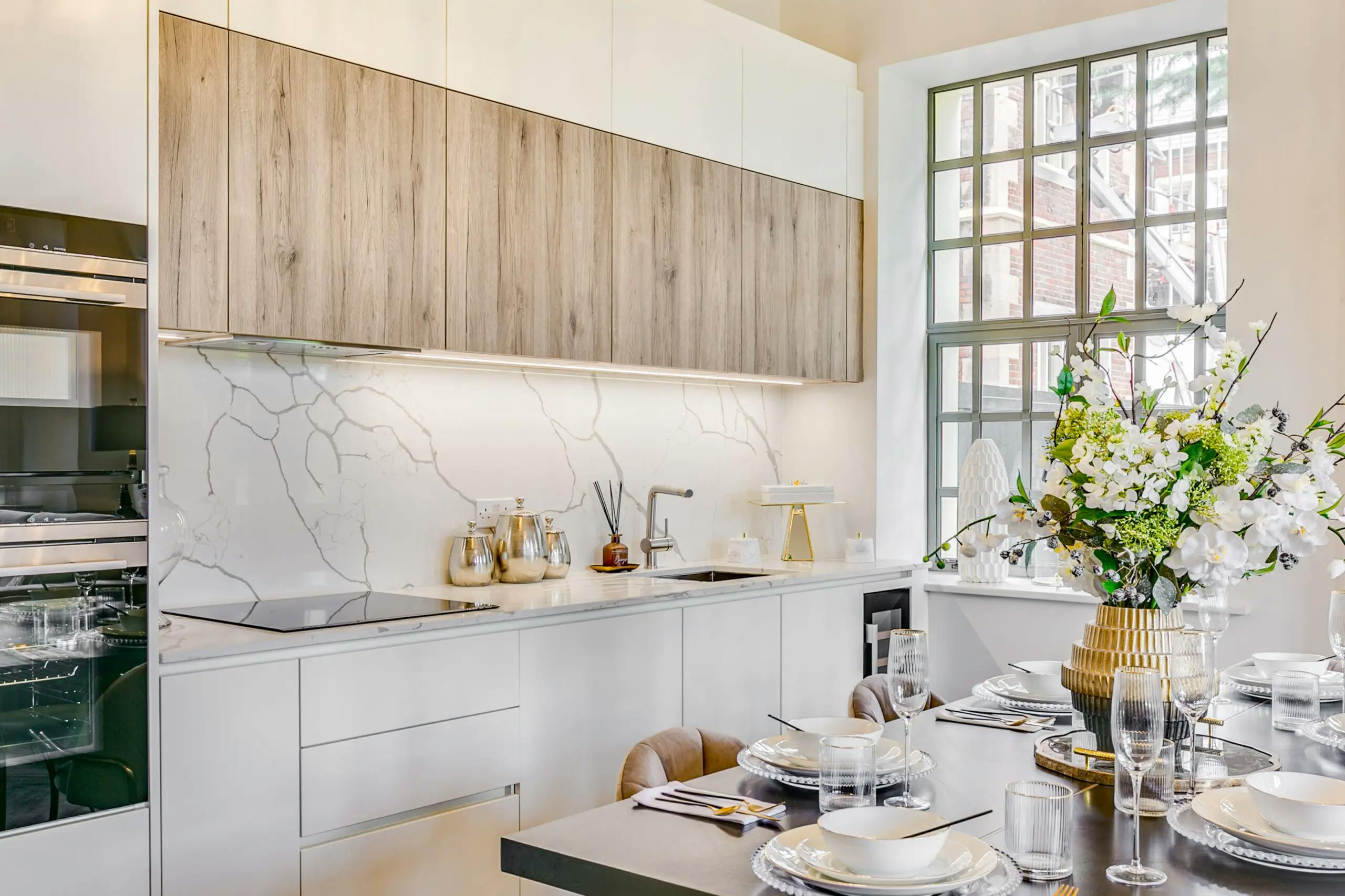 Caption: a kitchen with a table set for four