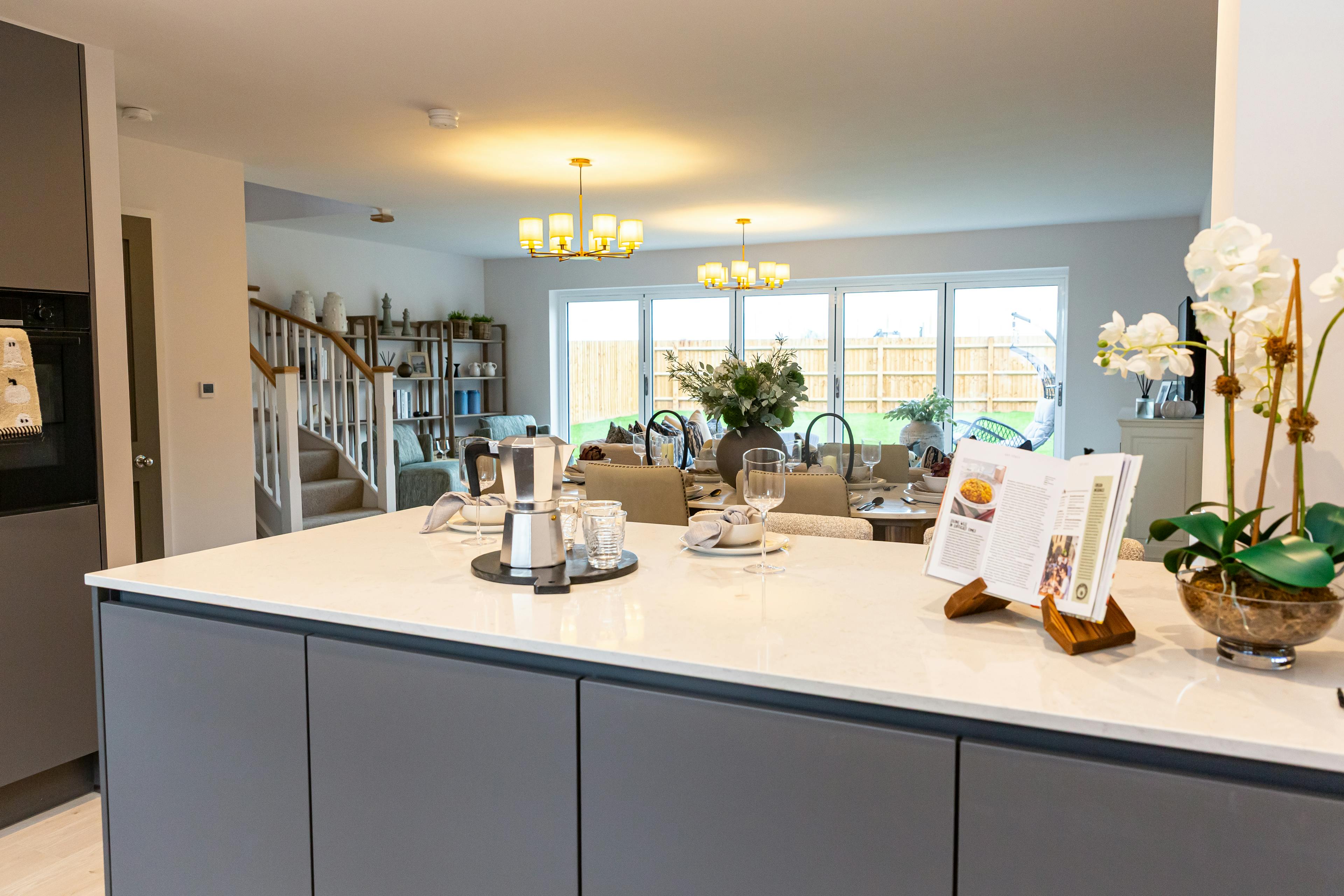 Caption: a kitchen with a refrigerator freezer sitting inside of it