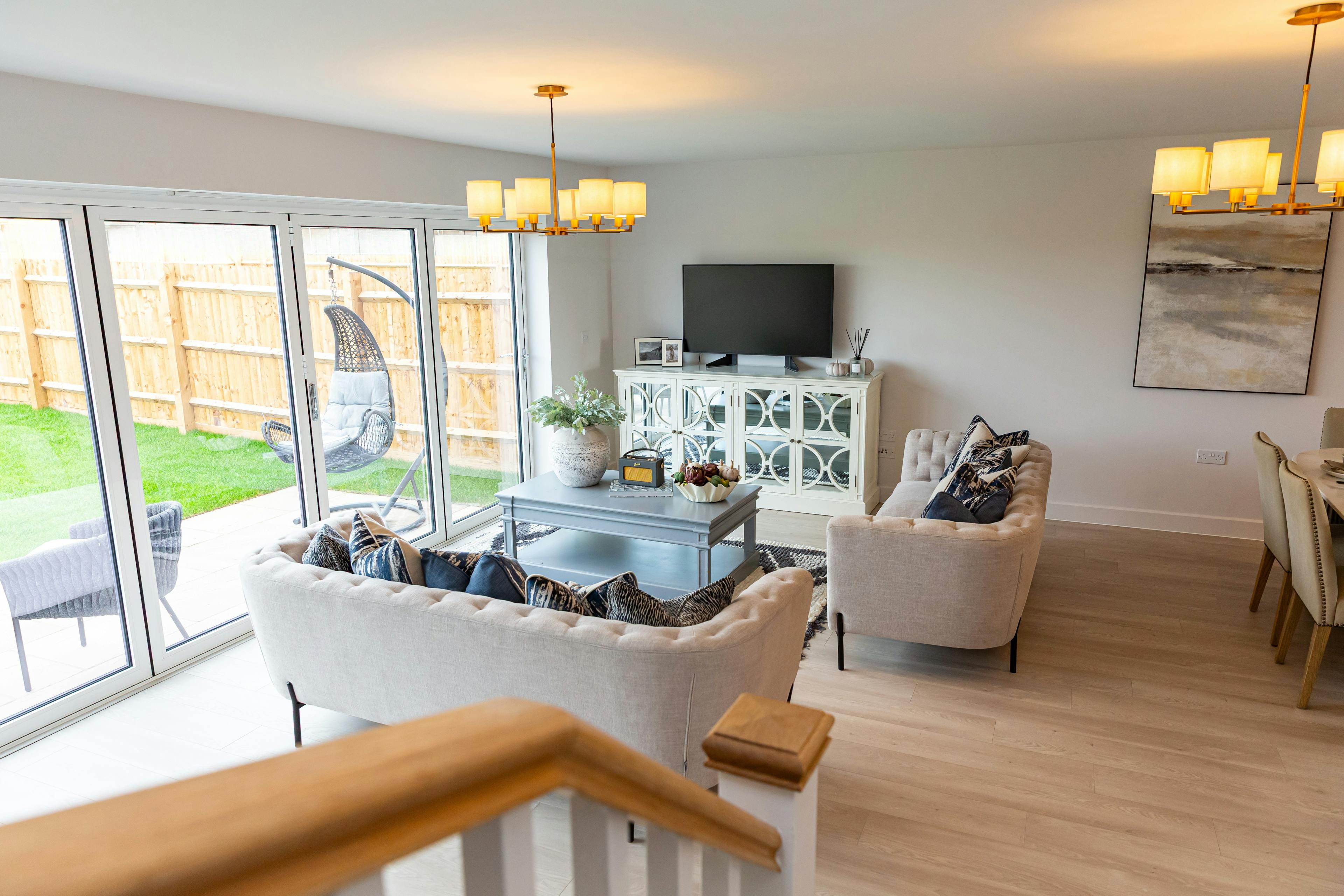Caption: a living room filled with furniture and a flat screen tv