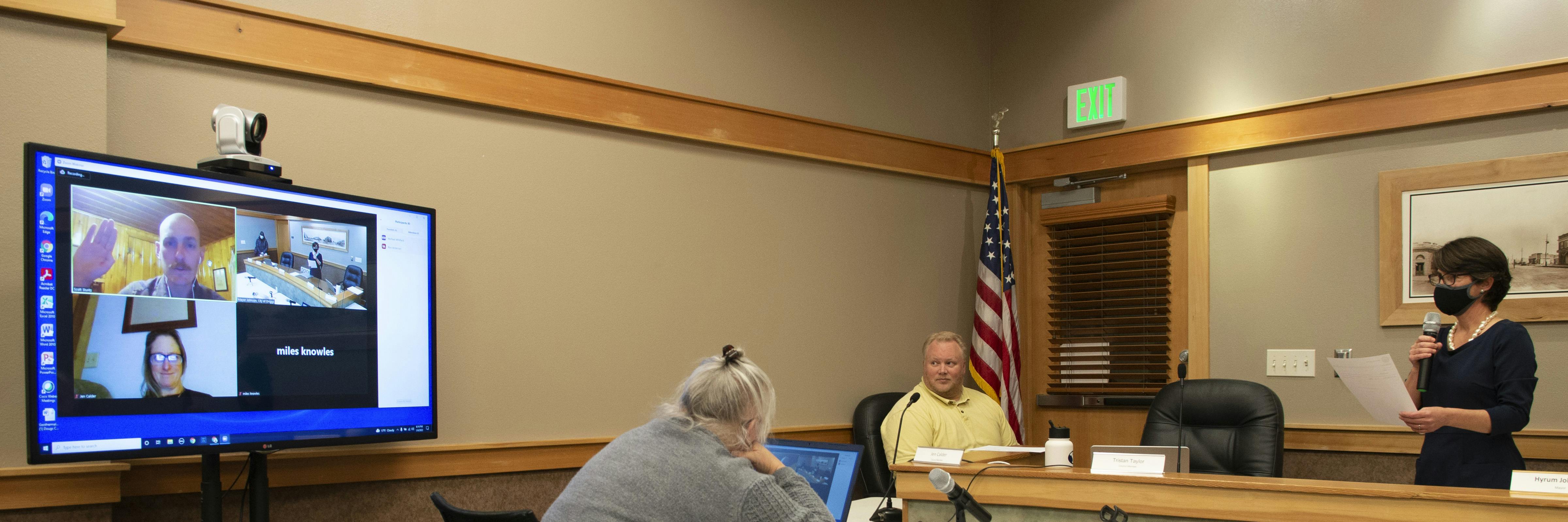 Scott Stunts being sworn in via Zoom to City Council