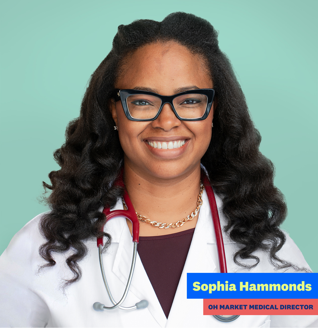 Portrait of Dr. Sophia Hammonds wearing a white coat and glasses while smiling.