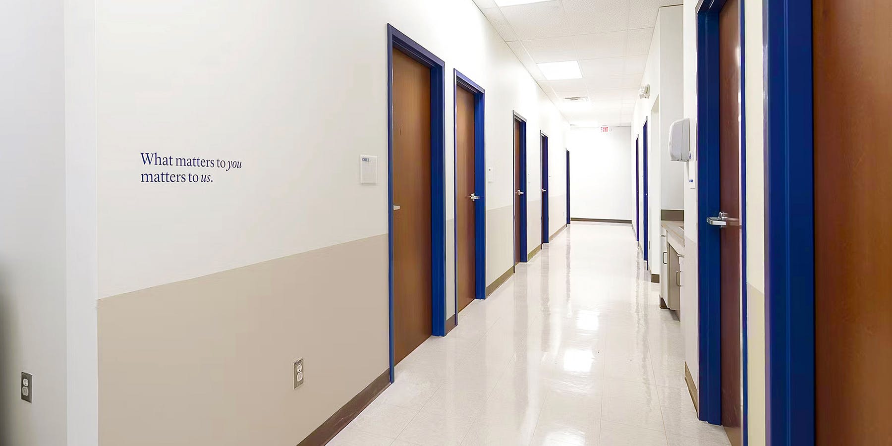 Hallway with doors at Cityblock High Point.