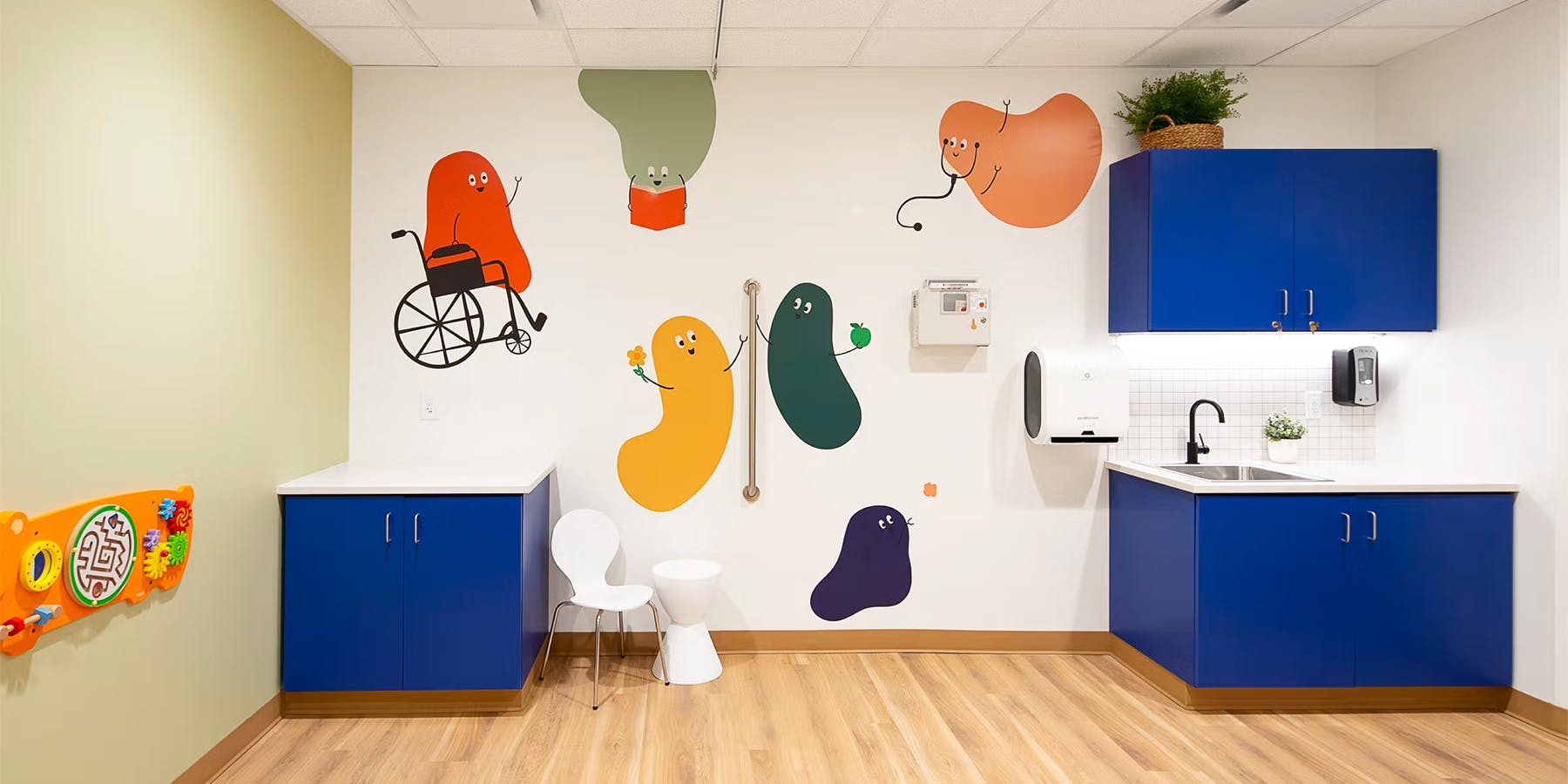 Pediatrics examination room with colorful mural on wall at Cityblock Winston-Salem, North Carolina