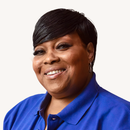 Portrait of Cityblock Community Health Partner wearing a blue polo.