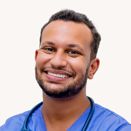 Portrait of a Clinical Pharmacist wearing blue scrubs.