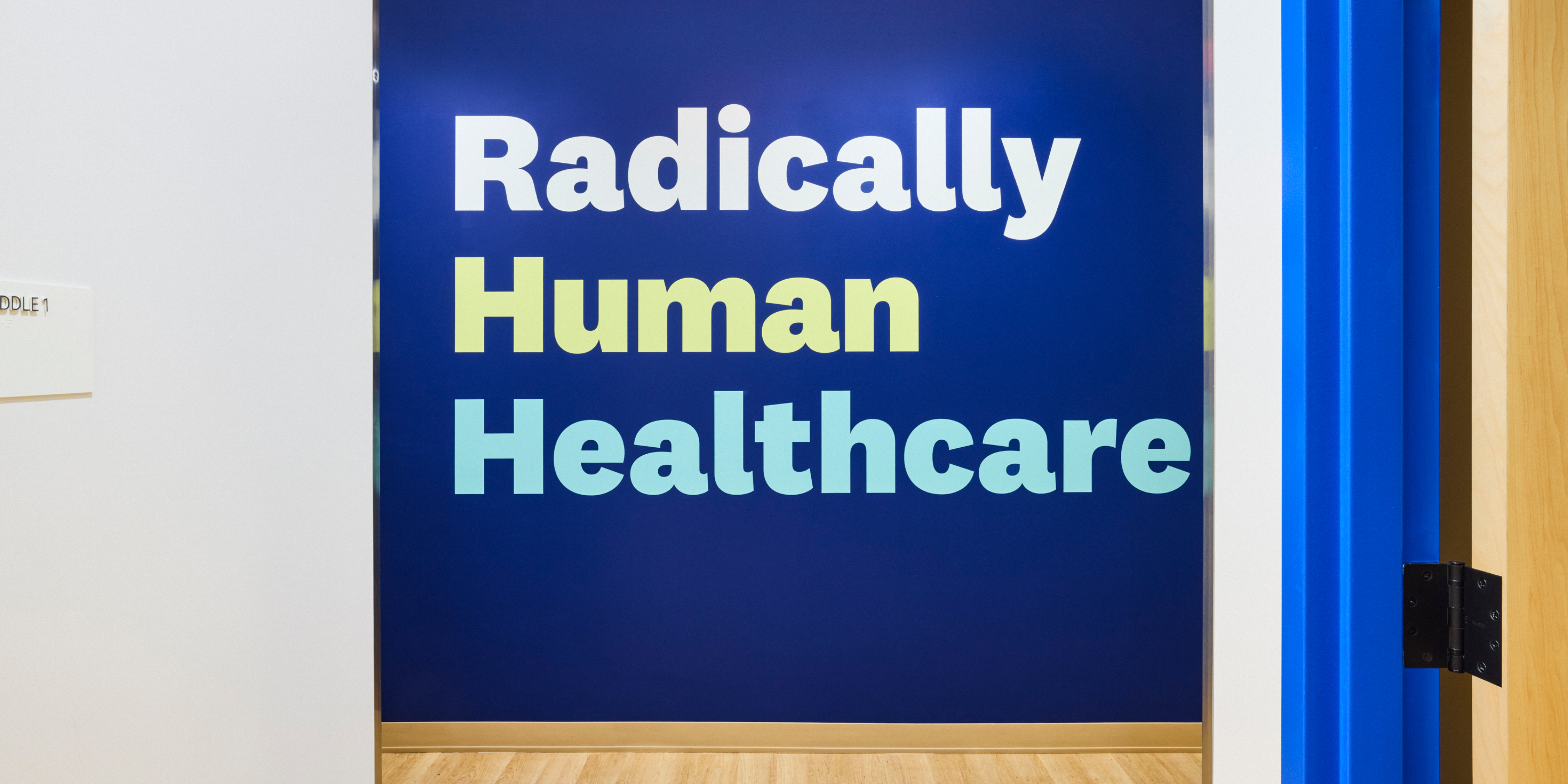 Hallway at Cityblock Bed-Stuy with wall art that says "Radically human healthcare."