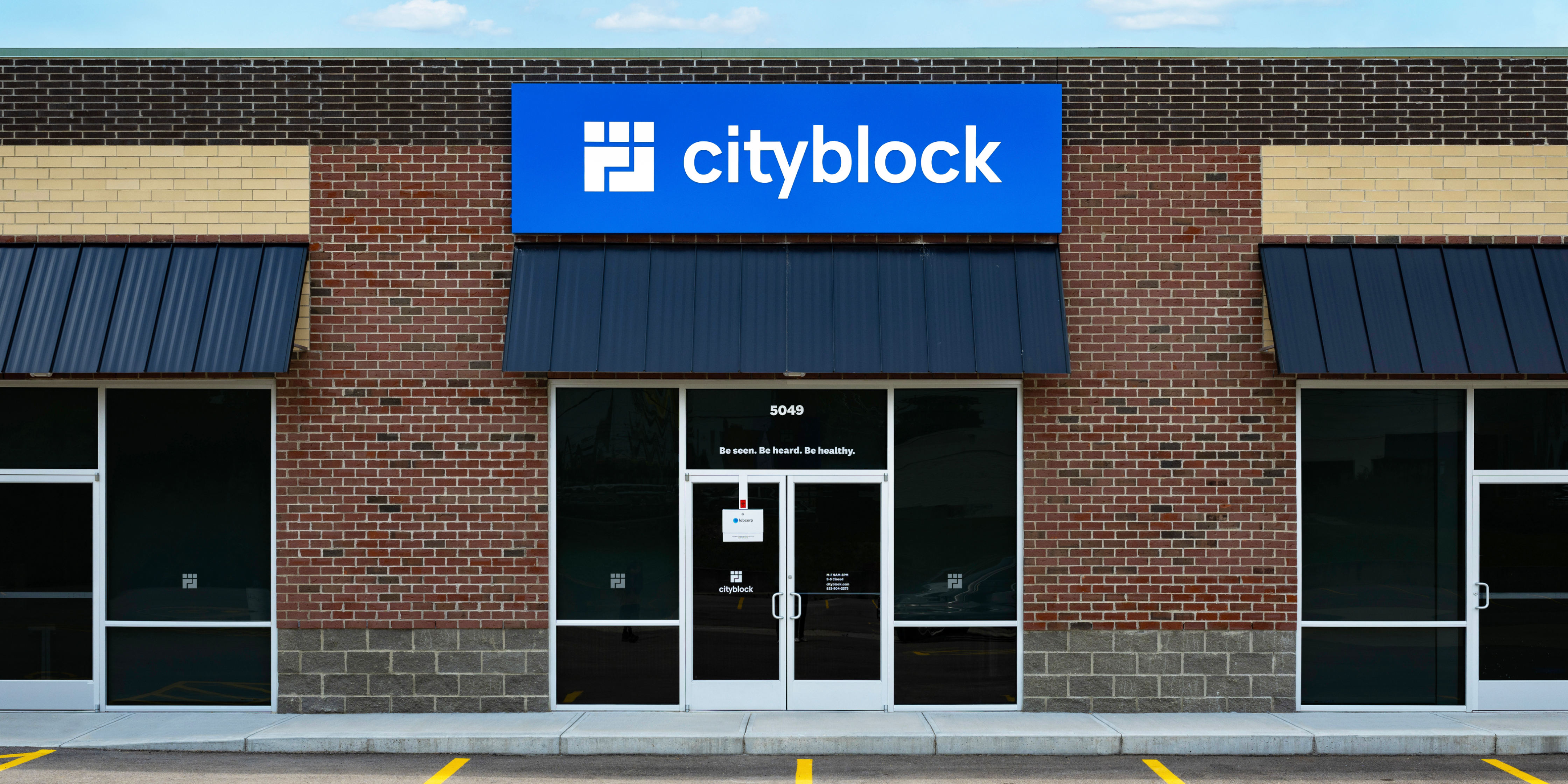 Front of Cityblock Health Cincinnati clinic with blue sign.