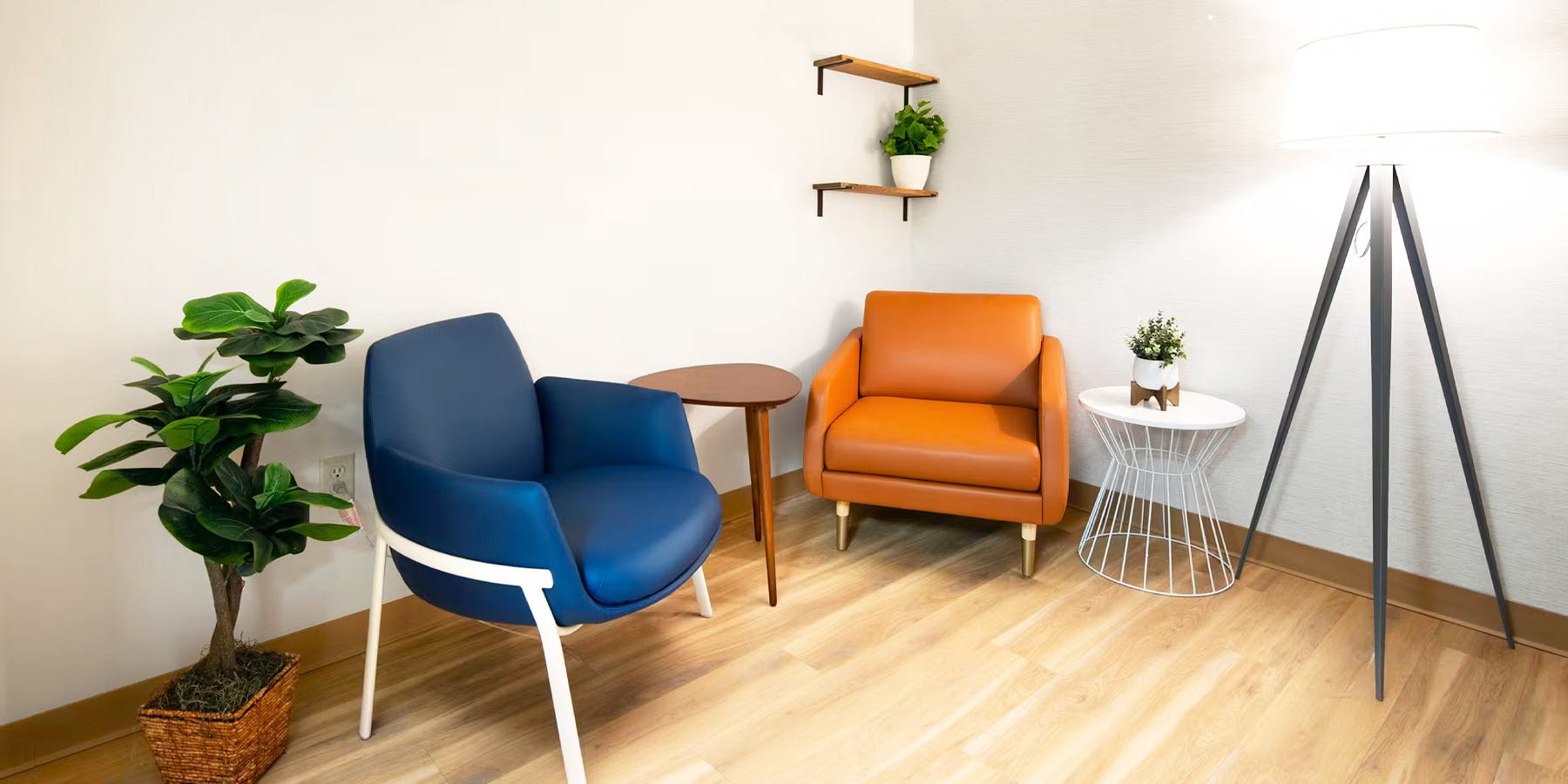 Waiting room with blue and orange chairs at Cityblock High Point