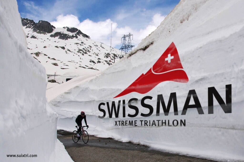 swissman triathlon participant on a street surrounded by snow