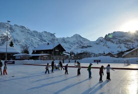 ice skating outdoors with panoramic view of the mountains