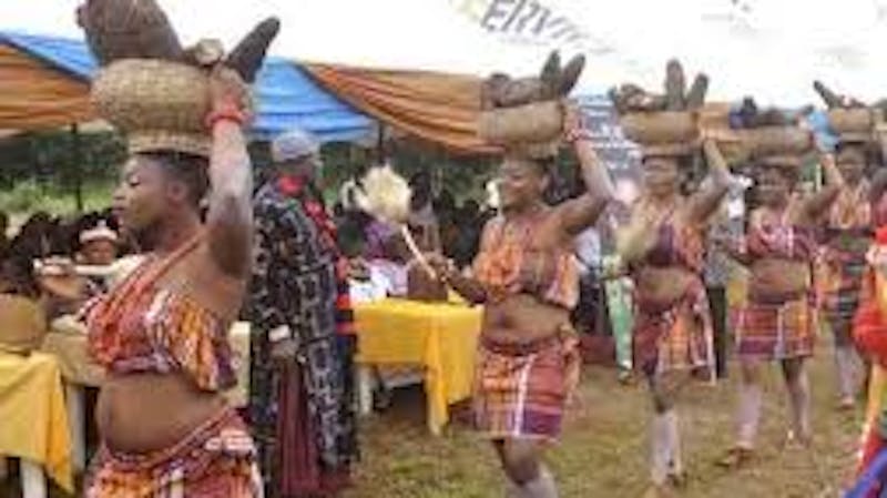 The young maiden during the new yam festival performing different dancing steps with yam on their heads