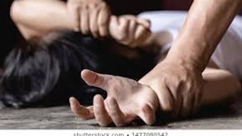 Rape, a man holding a lady down on the ground and about to rape her